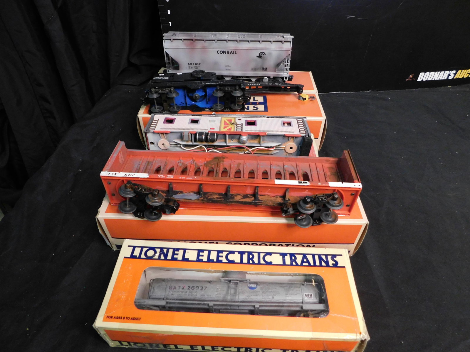 Lot of 5 Train Cars including a Diner: Lot of 5 Train Cars all in Not Original Packaging. Included in this lot are GATX 1 Dome Tank Car Customized 26937, Lionel Customized I-Beam Car, Angel Love Diner with Lights, Lionel Customized Crane C