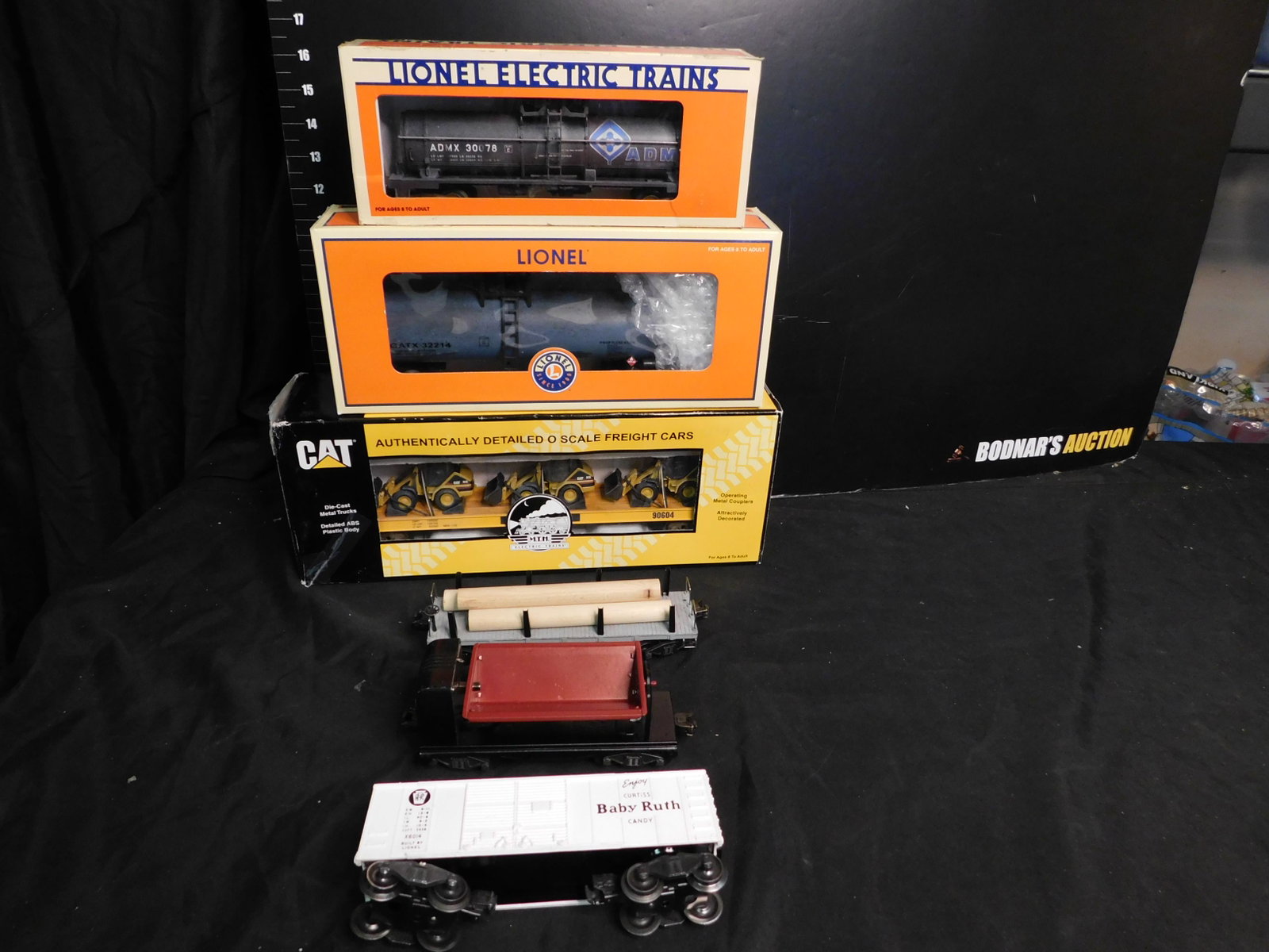 Lot of 6 Train Cars: Lot of 6 Train Cars including Baby Ruth 027 Box Car X6014 - Ex Cond, Lionel Coal Dump Car Repainted Bin, 2411 Diecast Lionel Flatcar with 3 Logs - Ex Cond., Lionel ADM 1 Dome Tank Car Customized, GATX