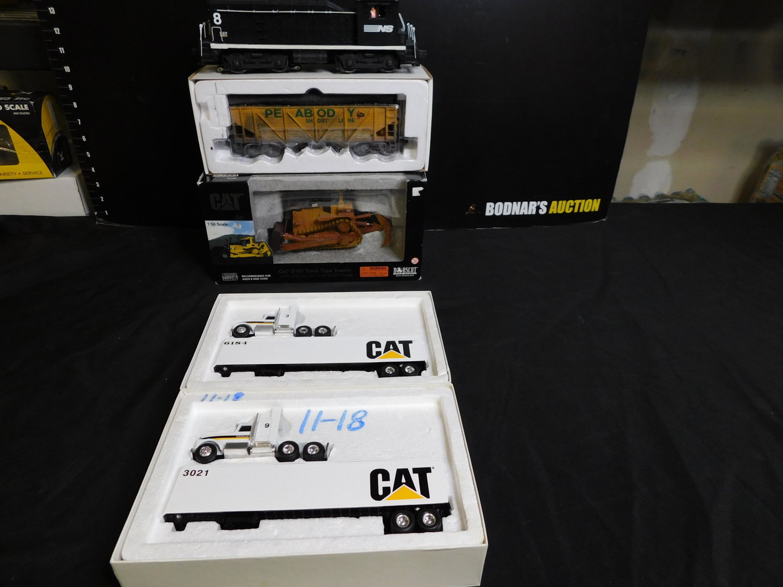 Group of 5 Train Cars: Group of 5 Train Cars including Post War Lionel NW2 Switcher Customized for Norfolk Southern with QSI Sound Board, K-Line Diecast Hopper - Customized, Norscot Track Type Tractor and 2 ERTL Caterpillar