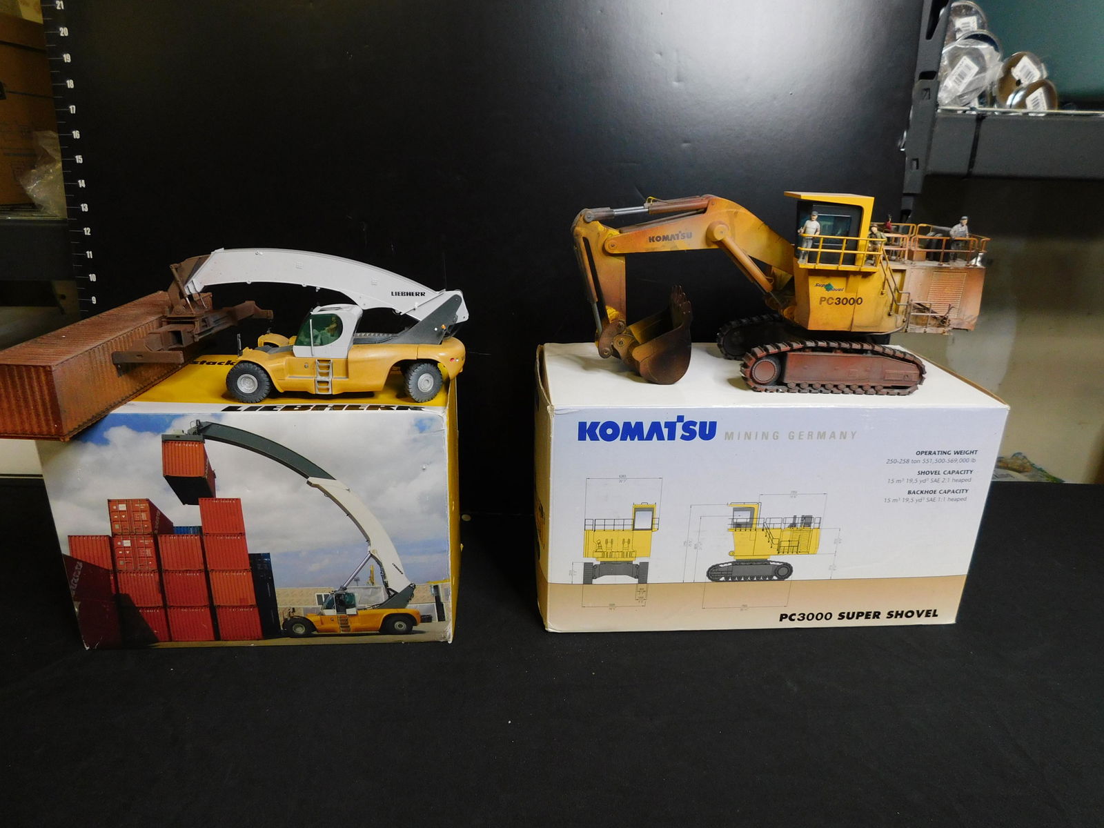 Lot of 2 Construction Vehicles: Lot of 2 Construction Vehicles including a Diecast Liebherr Reachstacker and Komatsu German PC 3000 Super Shovel - Weathered. You are bidding at a live sale, please read the terms and conditions. We a