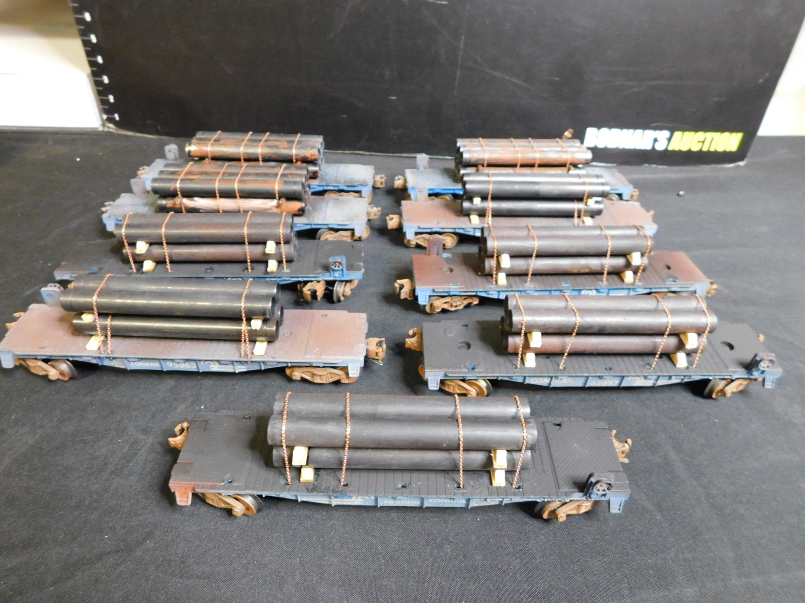 Lot of 9 Train Cars: Lot of 9 Train Cars including 3 x Conrail Lionel Flatcars with 6 Pipes on Each Customized and 6 x Lionel Conrail Flatcars with 4 Pipes on Each - Customized. You are bidding at a live sale, please read