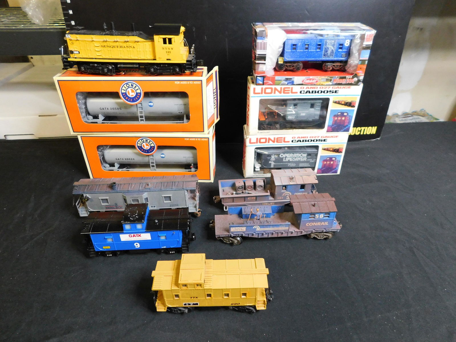 Group Lot of 11 Train Cars: Group Lot of 11 Train Cars including Lionel Post War Susquenna NW2 Switcher Customized with Sound, 2 x Lionel 1 Dome GATX Tank Cars 26585 and 26624, Lionel Bay Window Caboose Customized with Smoke and