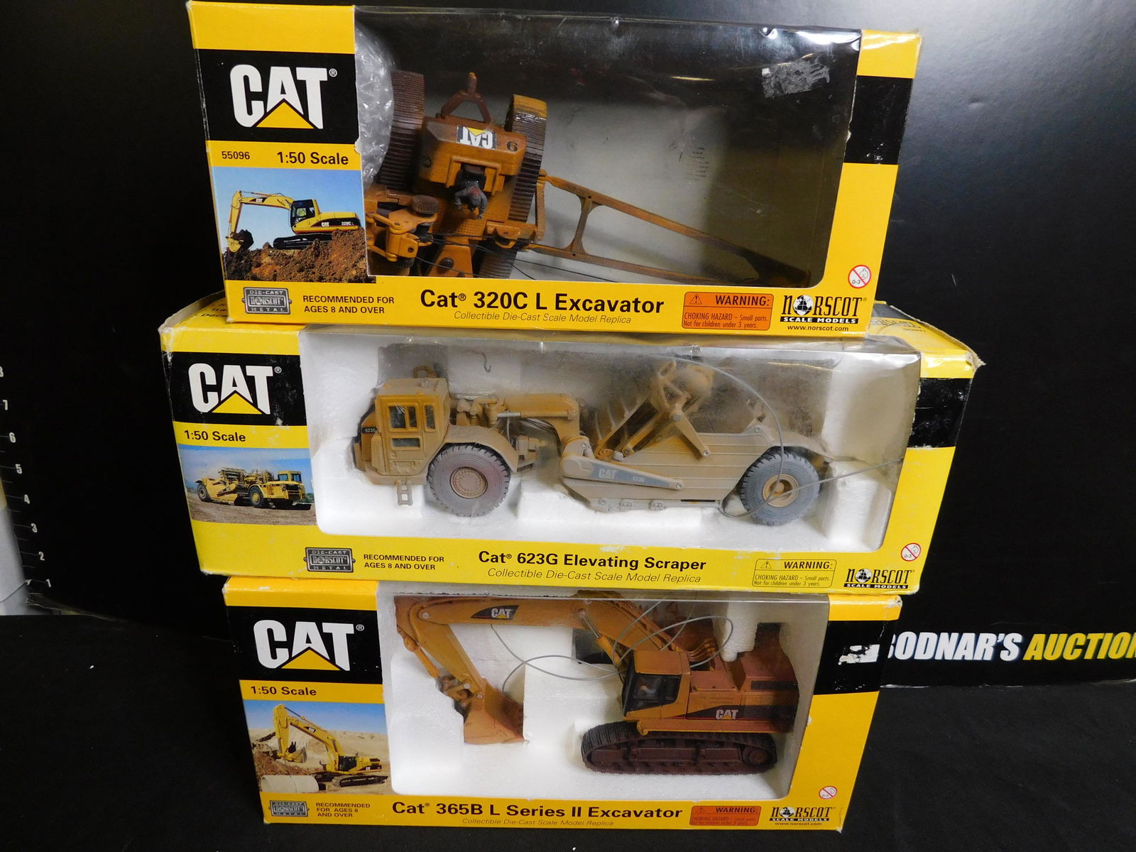 Lot of 3 Norscot CAT Construction Vehicles: Lot of 3 Norscot CAT Construction Vehicles including 320C L Excavator, 623G Elevating Scraper and 365B L Series 2 Excavator - All Weathered. You are bidding at a live sale, please read the terms and c