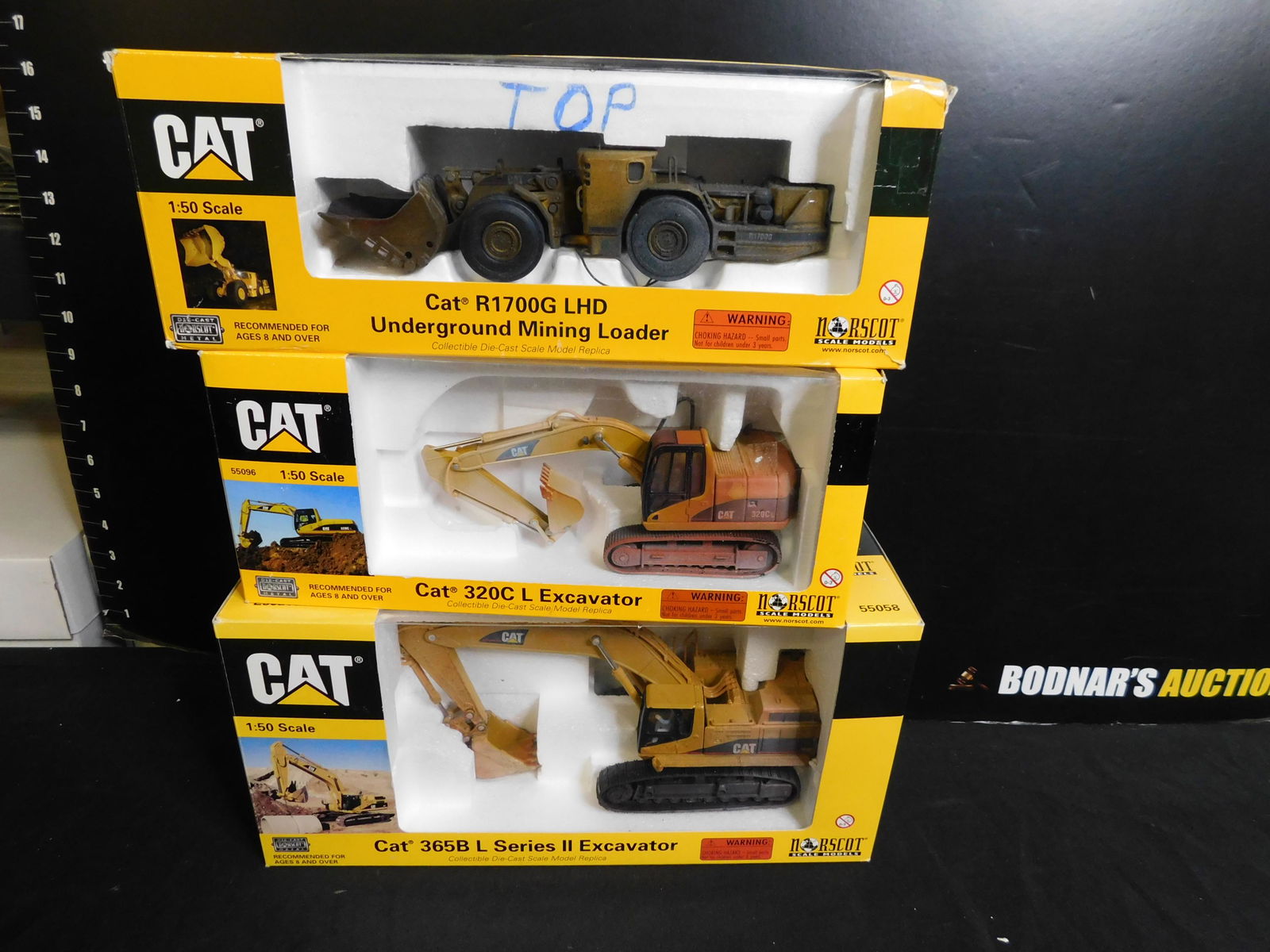 Lot of 3 Norscot CAT Construction Vehicles: Lot of 3 Norscot CAT Construction Vehicles including R1700G Underground Mining Loader, 320C Excavator and 364B Series 2 Excavator - All Weathered. You are bidding at a live sale, please read the terms