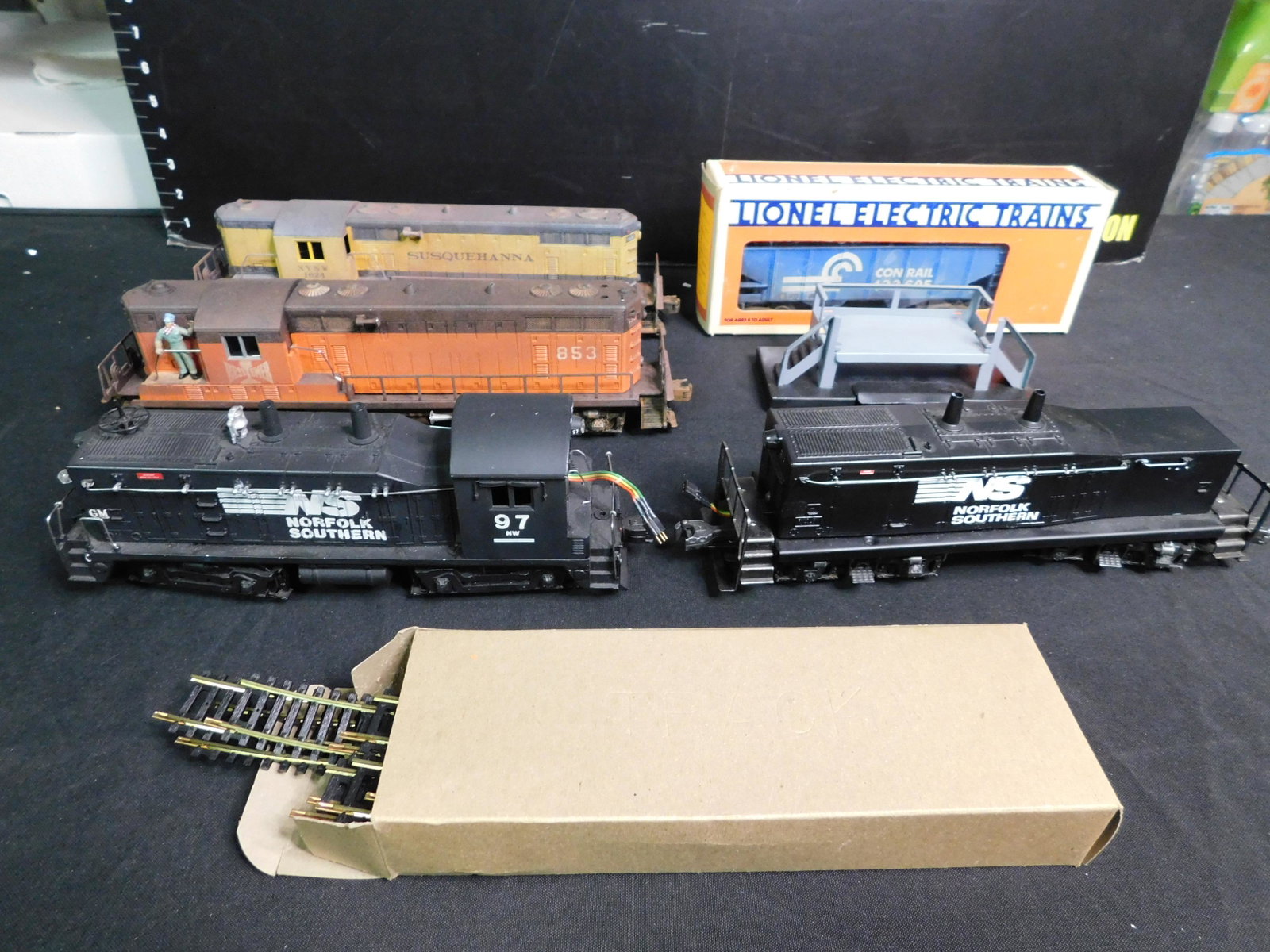 Lot of Train Cars and Accessories with Diesel Engines: Lot of 7 Train Cars and Accessories including Lionel Post War NW2 Switcher Customized Norfolk Southern with Sound and Directional and Custom Made Diesel Tender with a wire connection to run in tandem,
