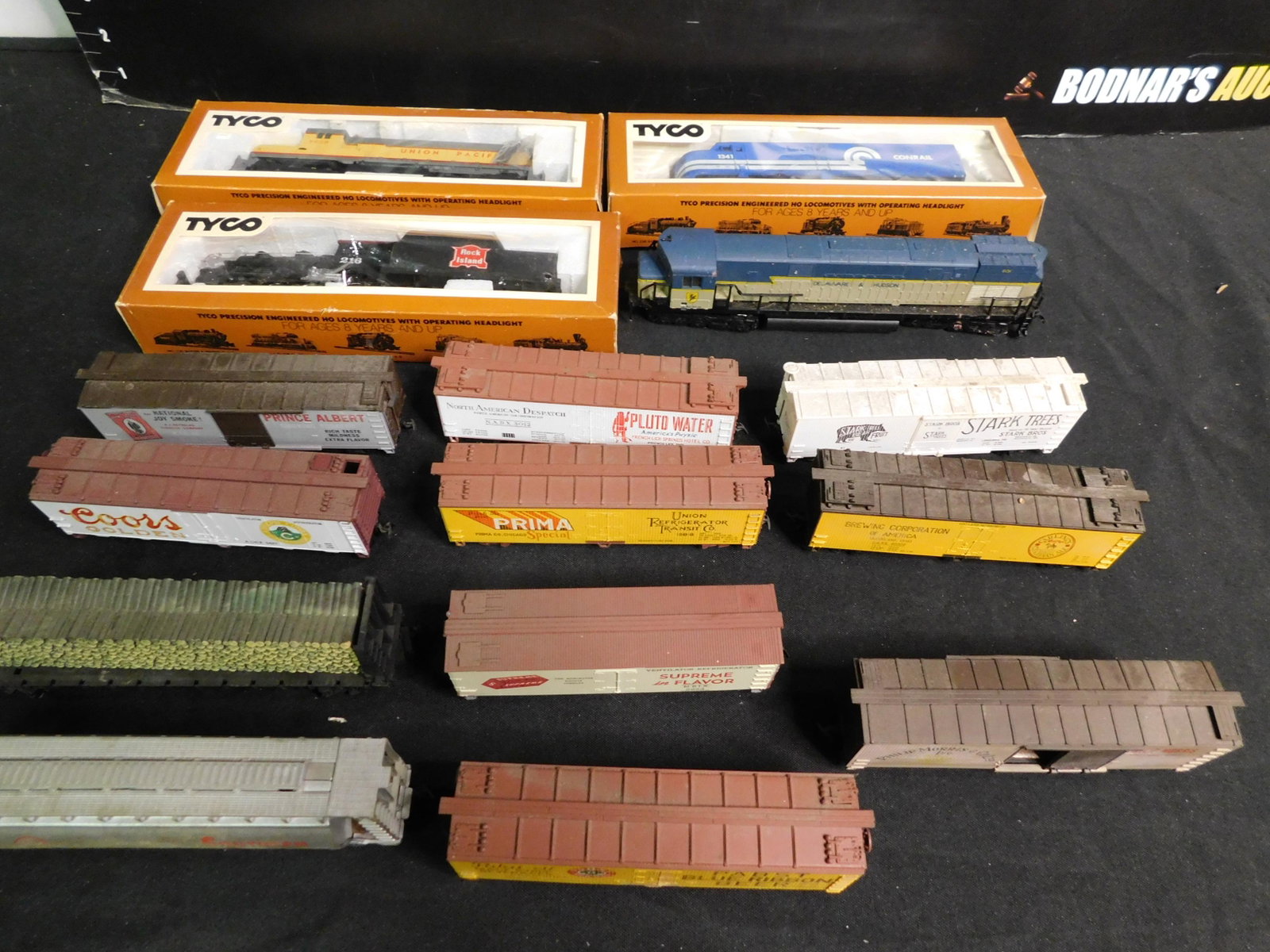 Group Lot of HO Scale Trains with 4 Engines: Group Lot of 15 HO Scale Trains including 4 Engines and 11 Pieces of Rolling Stock. You are bidding at a live sale, please read the terms and conditions. We are offering contact-less pick ups at our S