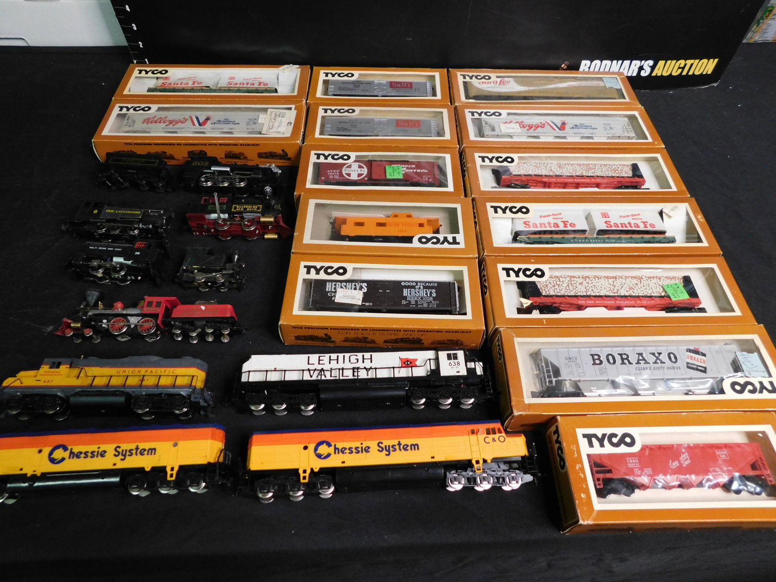 Large Lot of HO Scale Trains including 10 Engines: Group Lot of HO Scale Trains including 14 TYCO Rolling Stock, 10 HO Scale Engines - 4 Diesel and 6 Steam. You are bidding at a live sale, please read the terms and conditions. We are offering contact-
