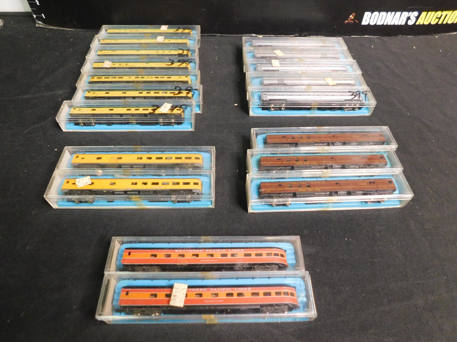 Large Lot of N Scale Passenger Cars: Group Lot of N Scale Passenger Cars - 19 Pieces. Included are Union Pacific 2 Car Set, Southern Pacific 2 Car Set, Pennsylvania RR 3 Car Set, Penn Central 5 Car Set and Chicago and Northwestern 7 Car 