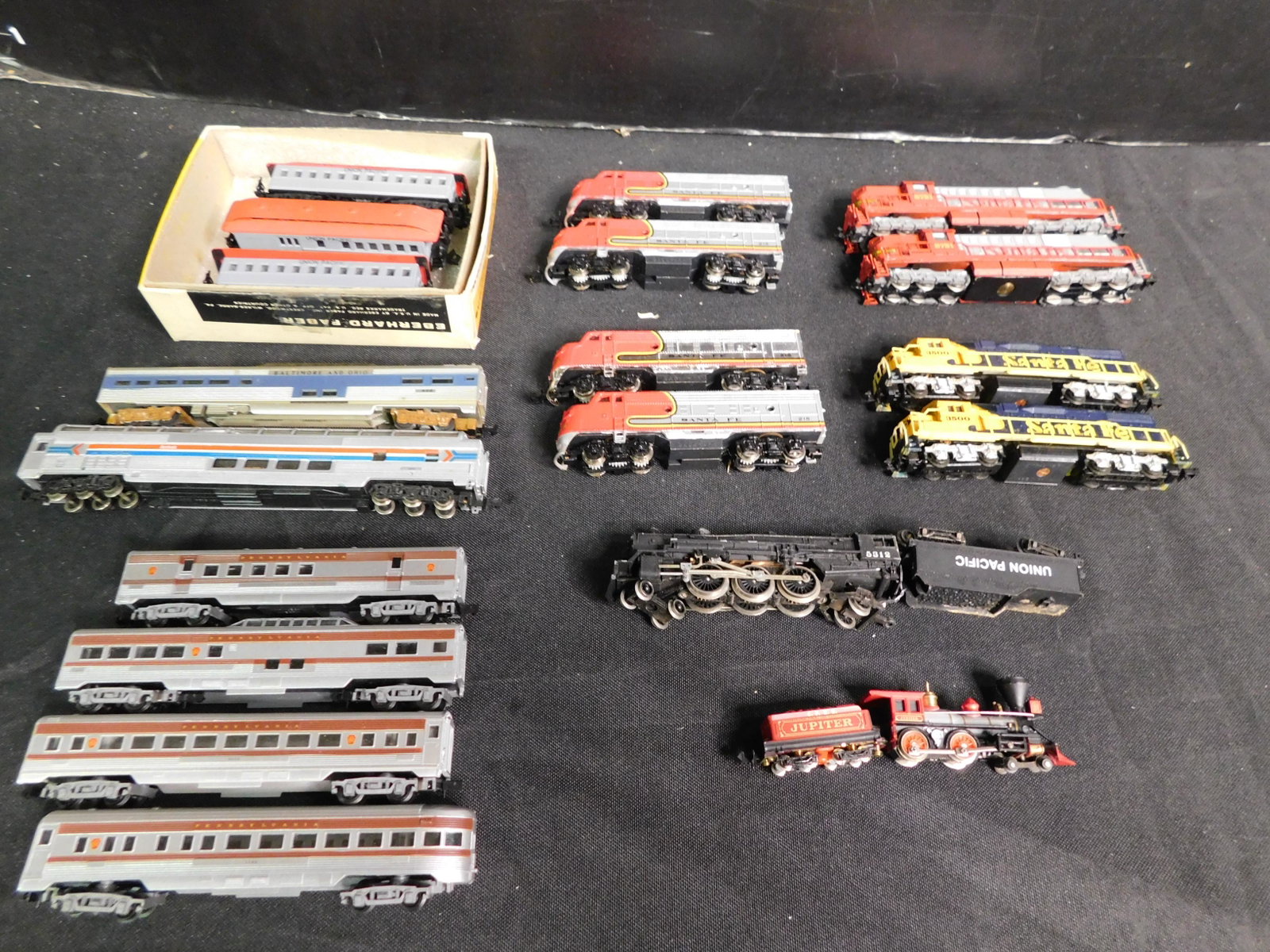 Lot of 19 N Scale Engines and Passenger Cars: Lot of 19 N Scale Passenger Cars and Engines including 9 Passenger Cars, 8 Diesel Engines and 2 Steam Engines. You are bidding at a live sale, please read the terms and conditions. We are offering con