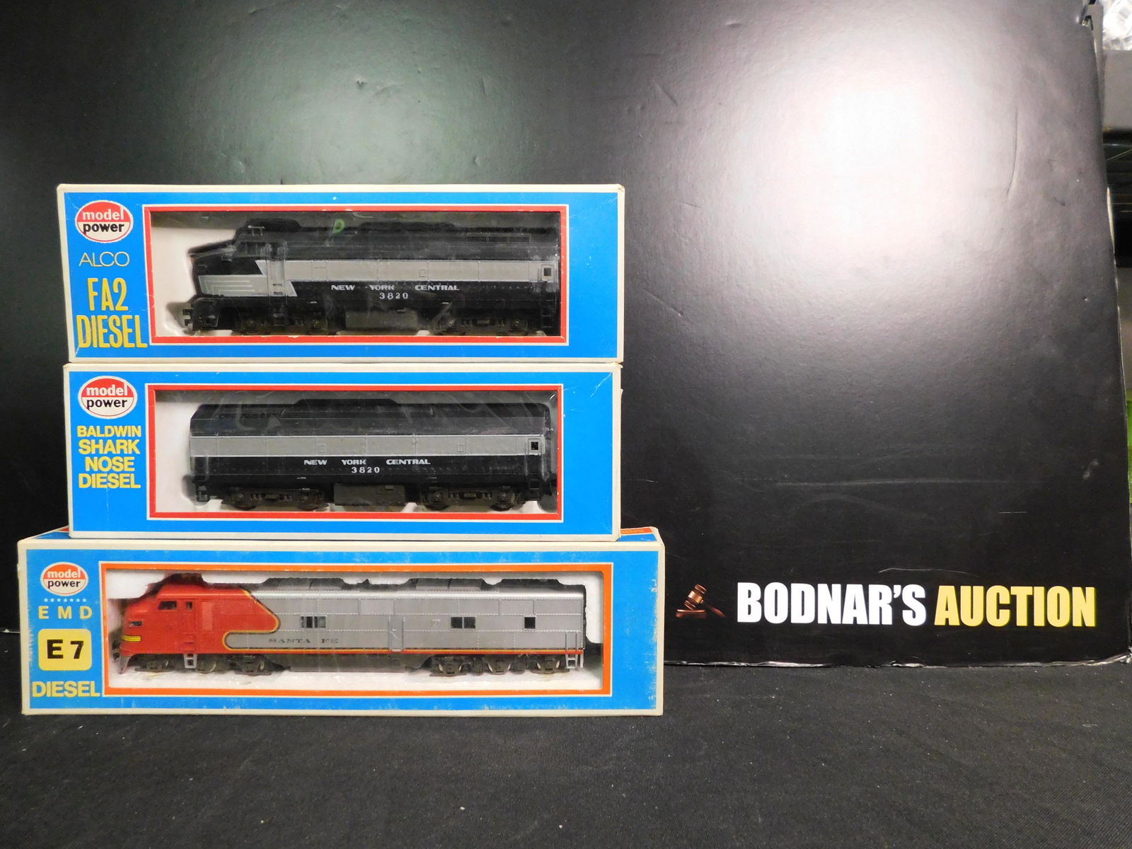Lot of 3 Model Power HO Scale Engines: Lot of 3 Model Power HO Scale Engines including EMD E7 Santa Fe Diesel, Alco FA2 NY Central Diesel - A Unit and Baldwin Shark nose Diesel - B Unit. You are bidding at a live sale, please read the term