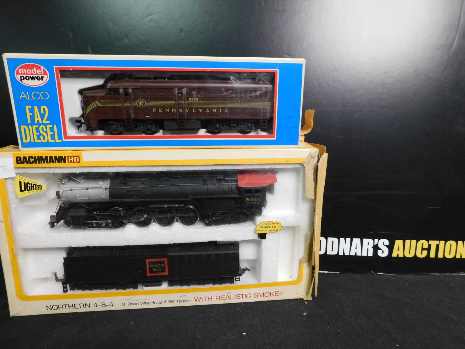 Lot of 2 HO Scale Engines including Bachmann and Model: Lot of 2 HO Scale Engines including Model Power Alco FA2 Pennsylvania Diesel and Bachmann 484 Burlington Route Steam Engine and Tender. You are bidding at a live sale, please read the terms and condit