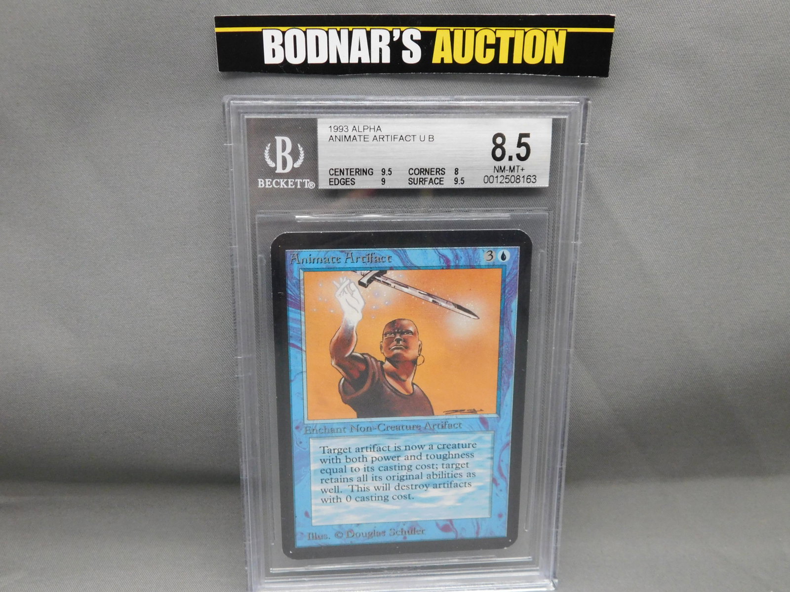 MTG Animate Artifact 1993 Alpha - BGS Graded: Magic the Gathering - Animate Artifact U B - Alpha Set 1993. Beckett Graded 8.5 NM-MT+. Centering 9.5, Edges 9, Corners 8 and Surface 9.5. Serial #0012508163. You are bidding at a live sale, please re