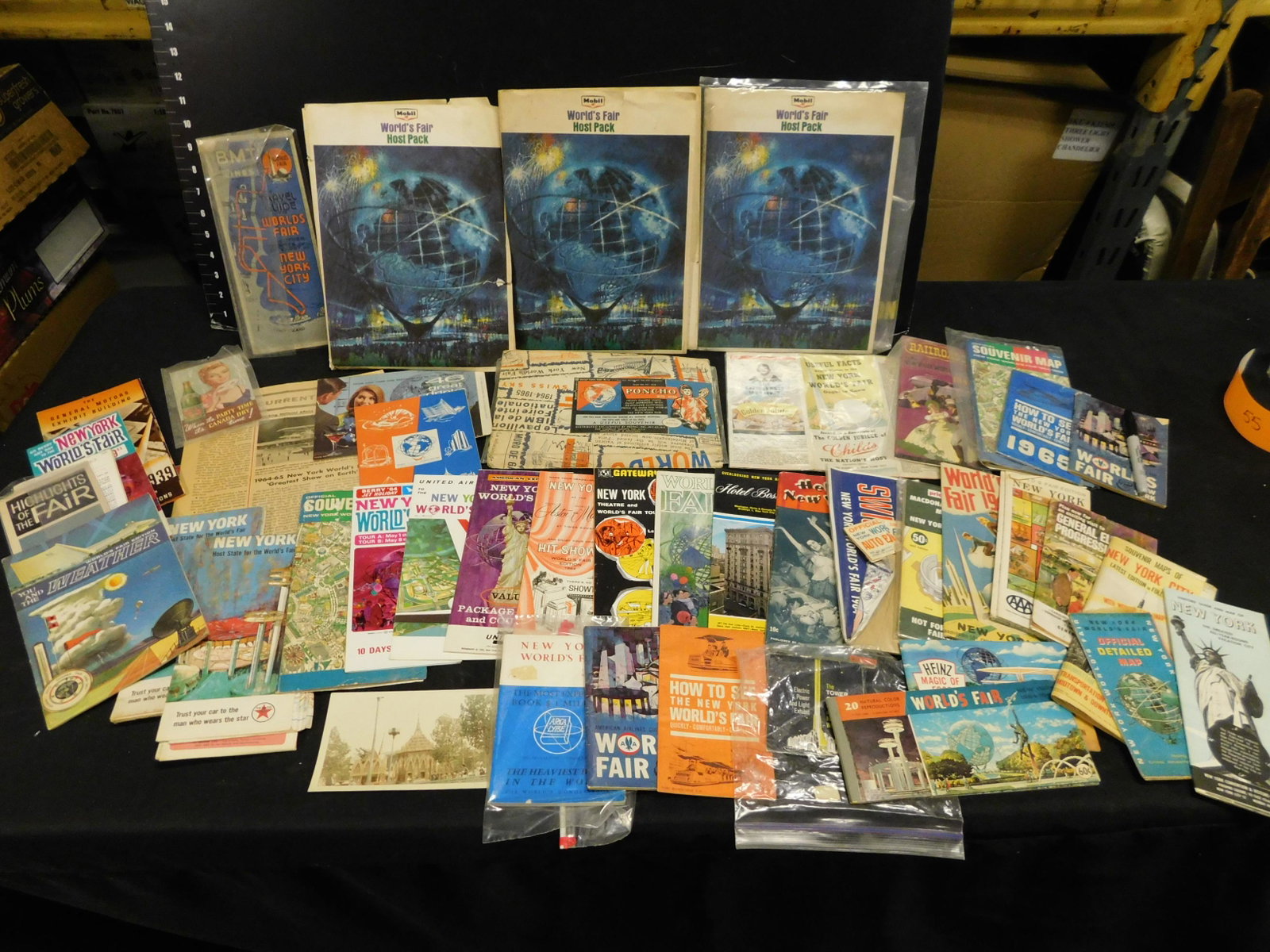 1964 New York World's Fair Brochures and Maps - Large: Large Group Lot of 1964 New York World's Fair Brochures and Maps. Over 40 Pieces. This sale will be broadcast live on sale day with an auctioneer and caller calling full descriptions of each lot being