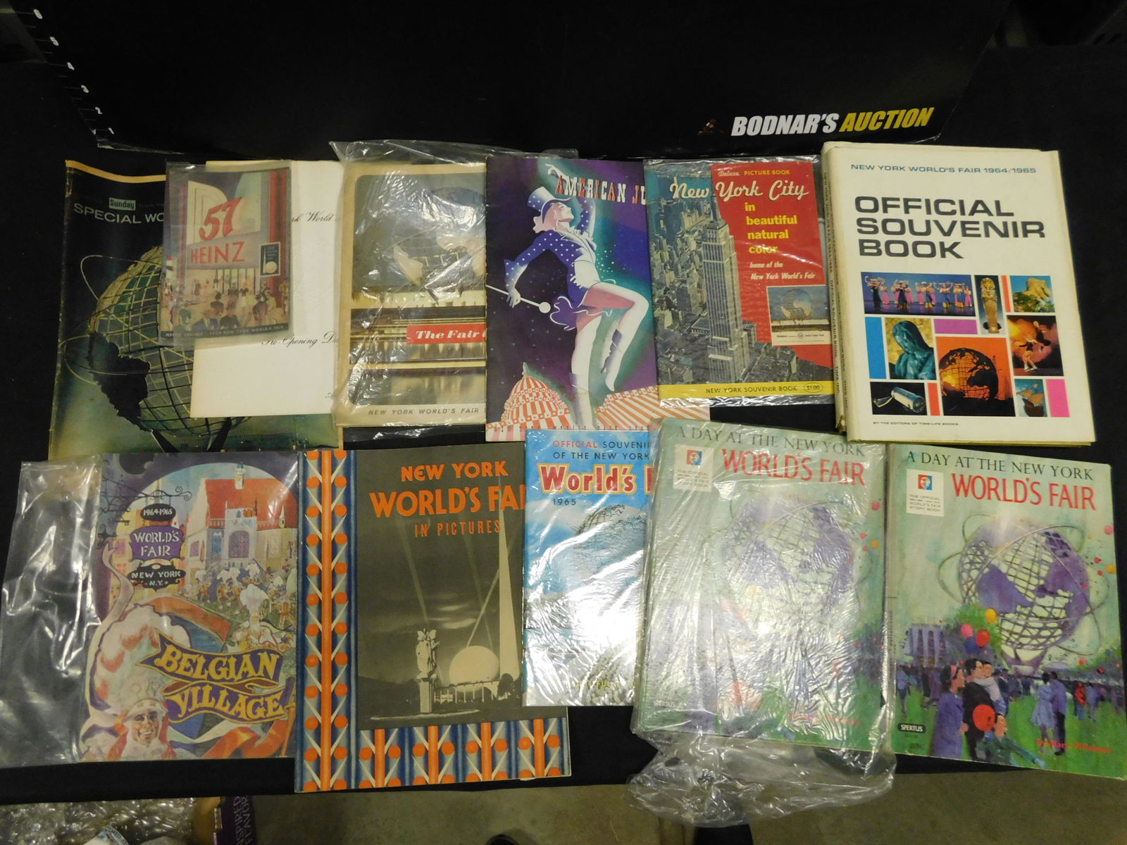 1964 New York World's Fair Souvenier Books and Program: Group Lot of 1964 New York World's Fair Souvenier Books and Programs. This sale will be broadcast live on sale day with an auctioneer and caller calling full descriptions of each lot being sold, as we