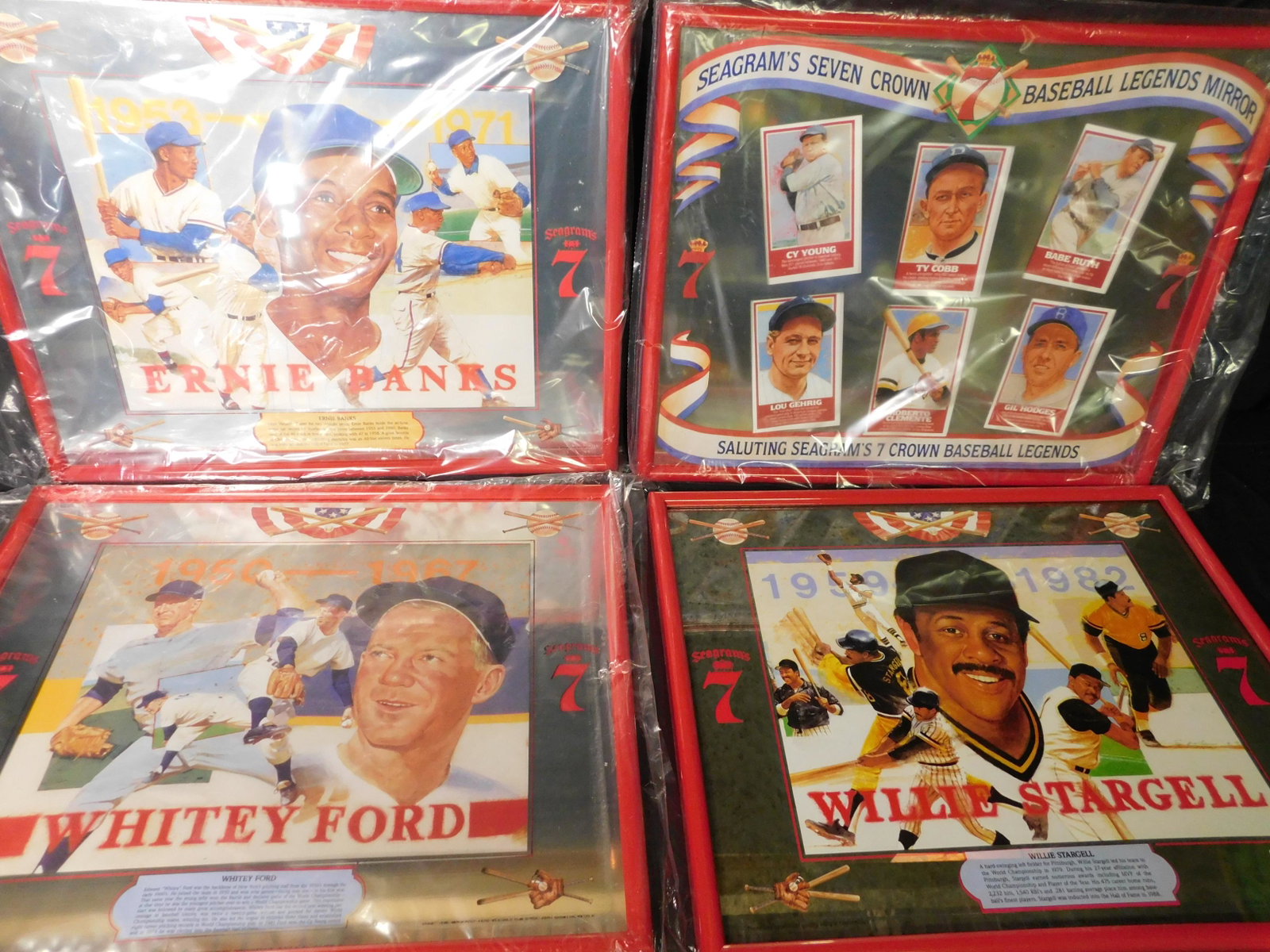 Lot of 4 Seagrams 7 Advertisment Baseball Mirrors and: Lot of 4 Seagrams 7 Baseball Mirrors and Framed Picture. Included in this lot is Ernie Banks, Baseball Legends, and Whitey Ford Framed Mirror. Also included is a Willie Stargell framed poster. This sa