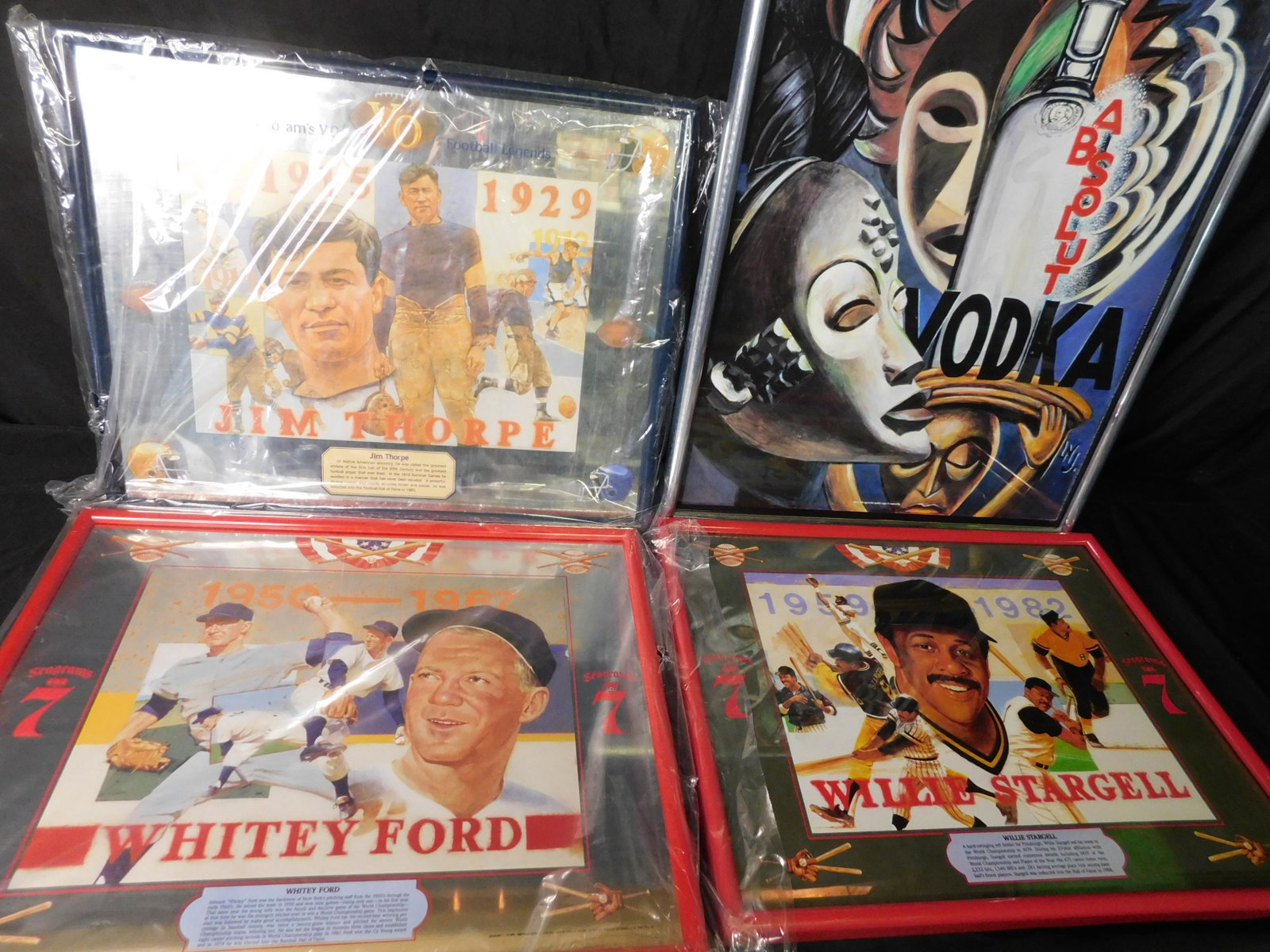Lot of 4 Seagrams 7, VO and Absolute Advertisment: Lot of 4 Seagrams 7, VO and Absolute Vodka Framed Posters and Mirrors. Included in this lot is Seagrams 7 Willie Stargell Poster, Sea 7 Whitey Ford Mirror and VO Jim Thorpe Mirror. Also included is a 