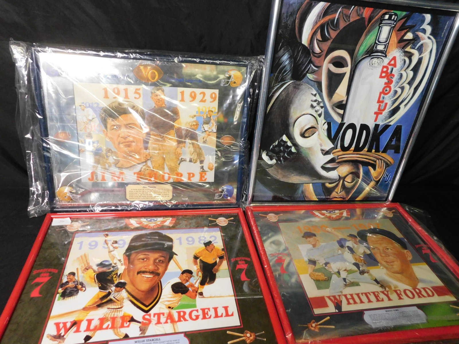 Lot of 4 Seagrams 7, VO and Absolute Advertisment: Lot of 4 Seagrams 7, VO and Absolute Vodka Framed Posters and Mirrors. Included in this lot is Seagrams 7 Willie Stargell Poster, Sea 7 Whitey Ford Mirror and VO Jim Thorpe Mirror. Also included is a 