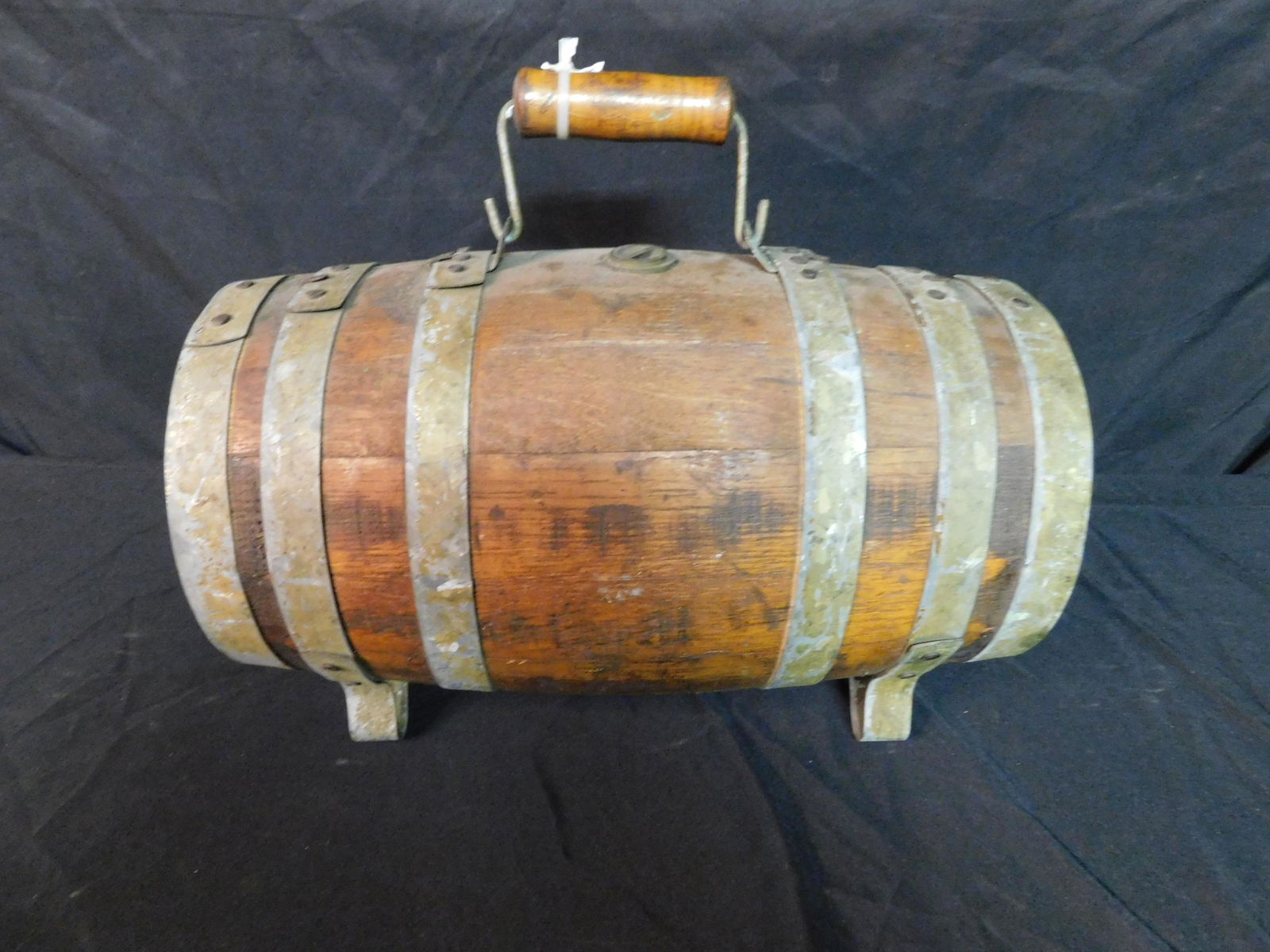 Vintatge Wine Keg/Barrel: Vintage Wine Keg/Barrel. Measures 18" long x 9" diameter. This sale will be broadcast live on sale day with an auctioneer and caller calling full descriptions of each lot being sold, as well as video