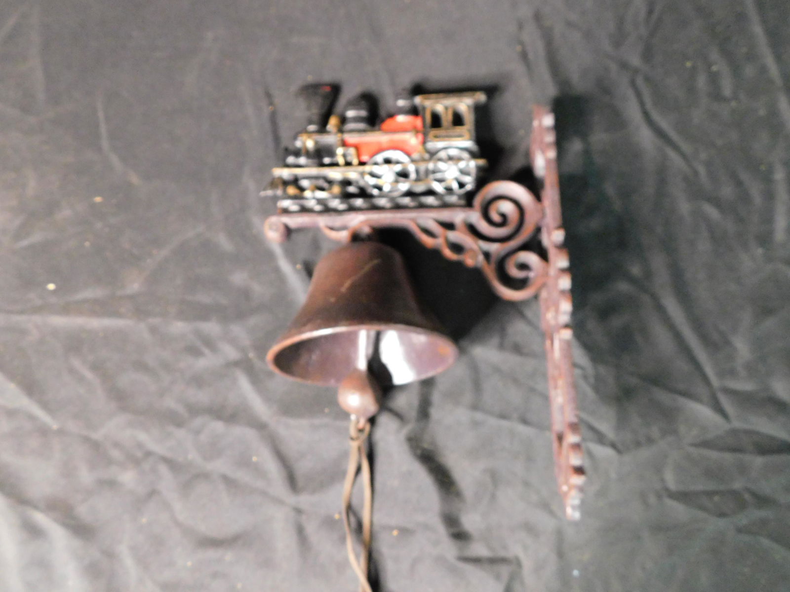 Contemorary Cast Iron Bell with Locomotive Wall Hanging: Contemorary Cast Iron Bell with Locomotive Wall Hanging. This sale will be broadcast live on sale day with an auctioneer and caller calling full descriptions of each lot being sold, as well as video f