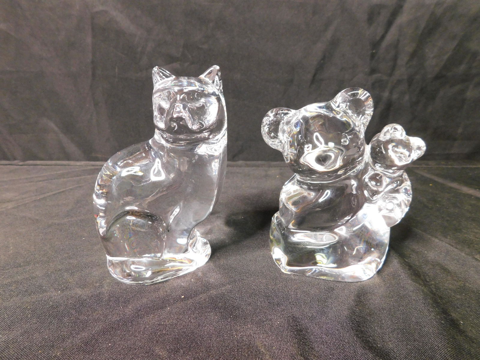 Lot of 2 Orrefors Glass Figurines: Lot of 2 Orrefors Glass Figurines One is a Cat 5" tall and the other is a Koala Bear with Cub 4.5" tall. This sale will be broadcast live on sale day with an auctioneer and caller calling full descrip