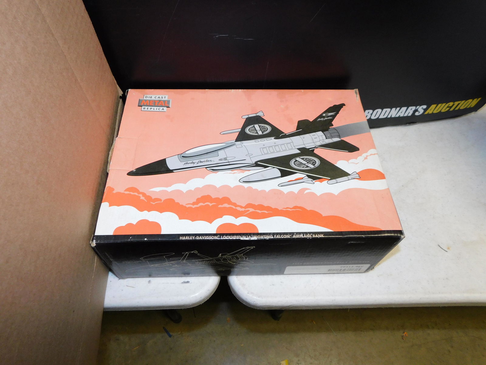 Harley Davidson Lockheed F16 Bank in Box: Harley Davidson Lockheed F16 Bank in Box. This sale will be broadcast live on sale day with an auctioneer and caller calling full descriptions of each lot being sold, as well as video feed of each lot