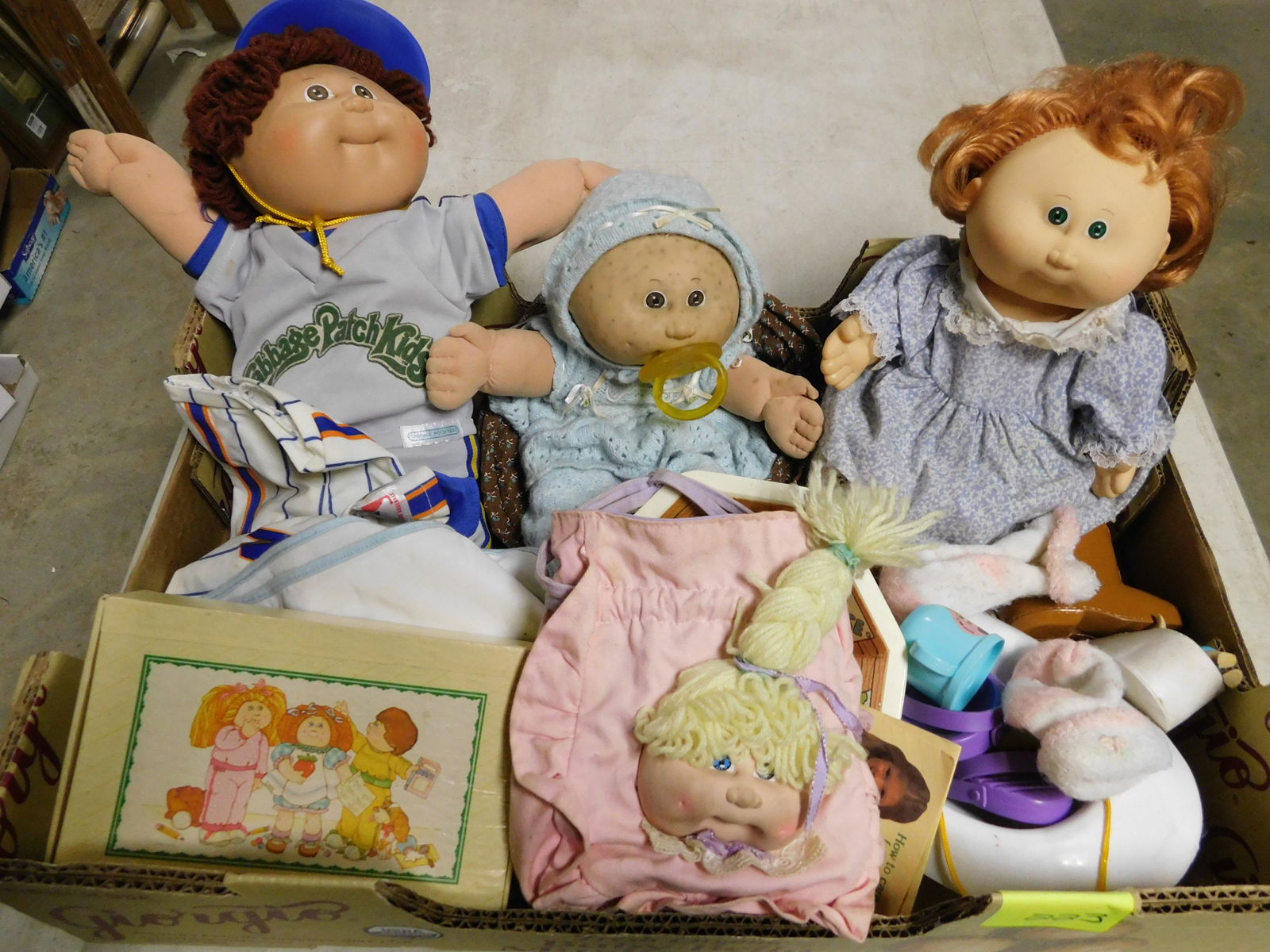 Box Lot with Cabbage Patch Kids: Box Lot with Cabbage Patch Kids and Cabbage Patch Accessories. This sale will be broadcast live on sale day with an auctioneer and caller calling full descriptions of each lot being sold, as well as v