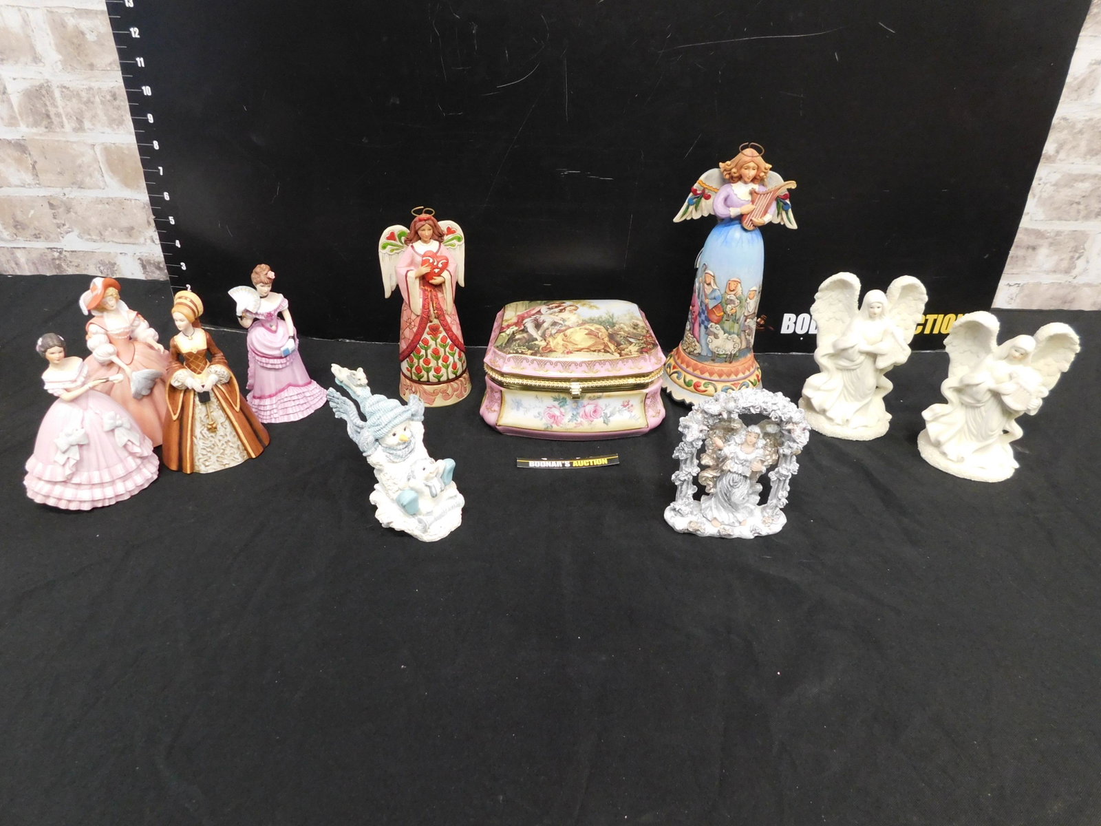 Box Lot of Figures including Lenox and Jim Shore: Box Lot of Figures including Lenox and Jim Shore. This sale will be broadcast live on sale day with an auctioneer and caller calling full descriptions of each lot being sold, as well as video feed of 