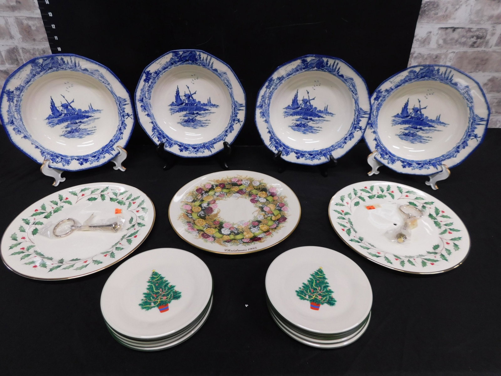 Box Lot with Lenox and Royal Daulton: Box Lot with Lenox Christmas Plates and Royal Daulton Blue and White Bowls. This sale will be broadcast live on sale day with an auctioneer and caller calling full descriptions of each lot being sold,