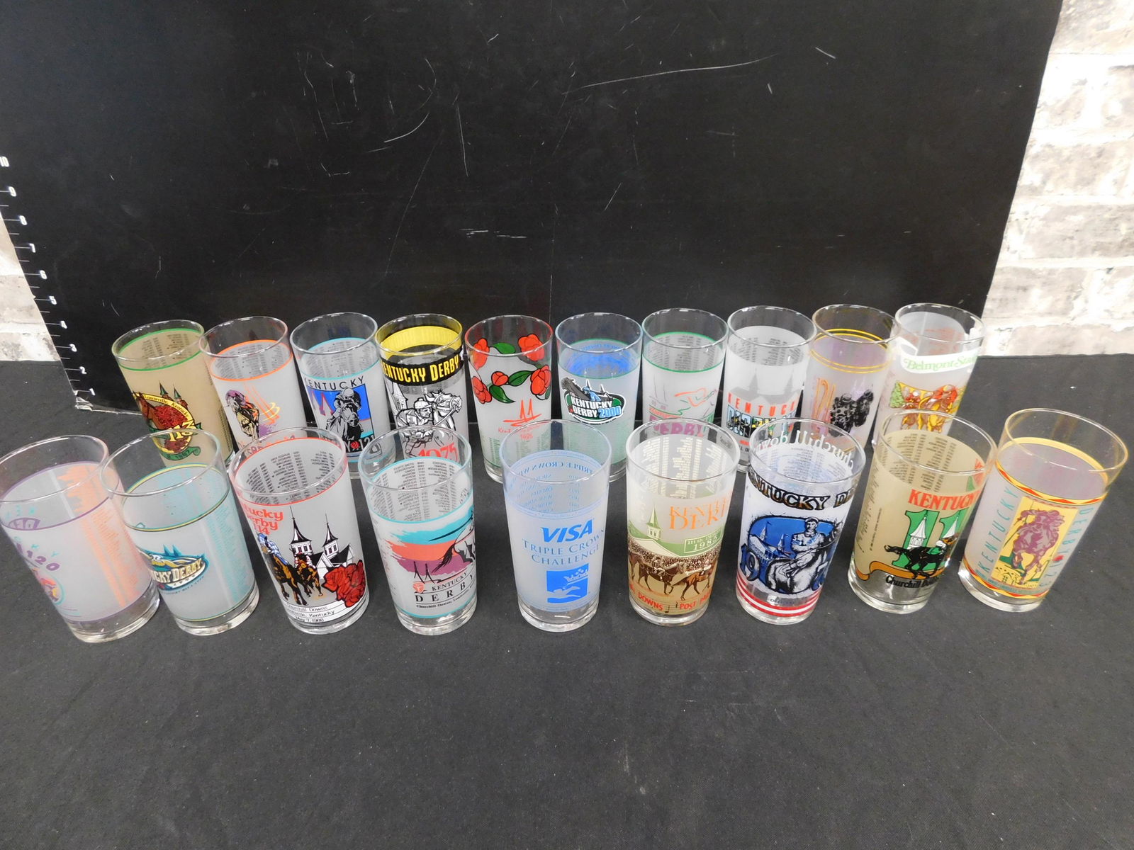 Group Lot of Kentucky Derby Glasses: Group Lot of Kentucky Derby Glasses. This sale will be broadcast live on sale day with an auctioneer and caller calling full descriptions of each lot being sold, as well as video feed of each lot. All