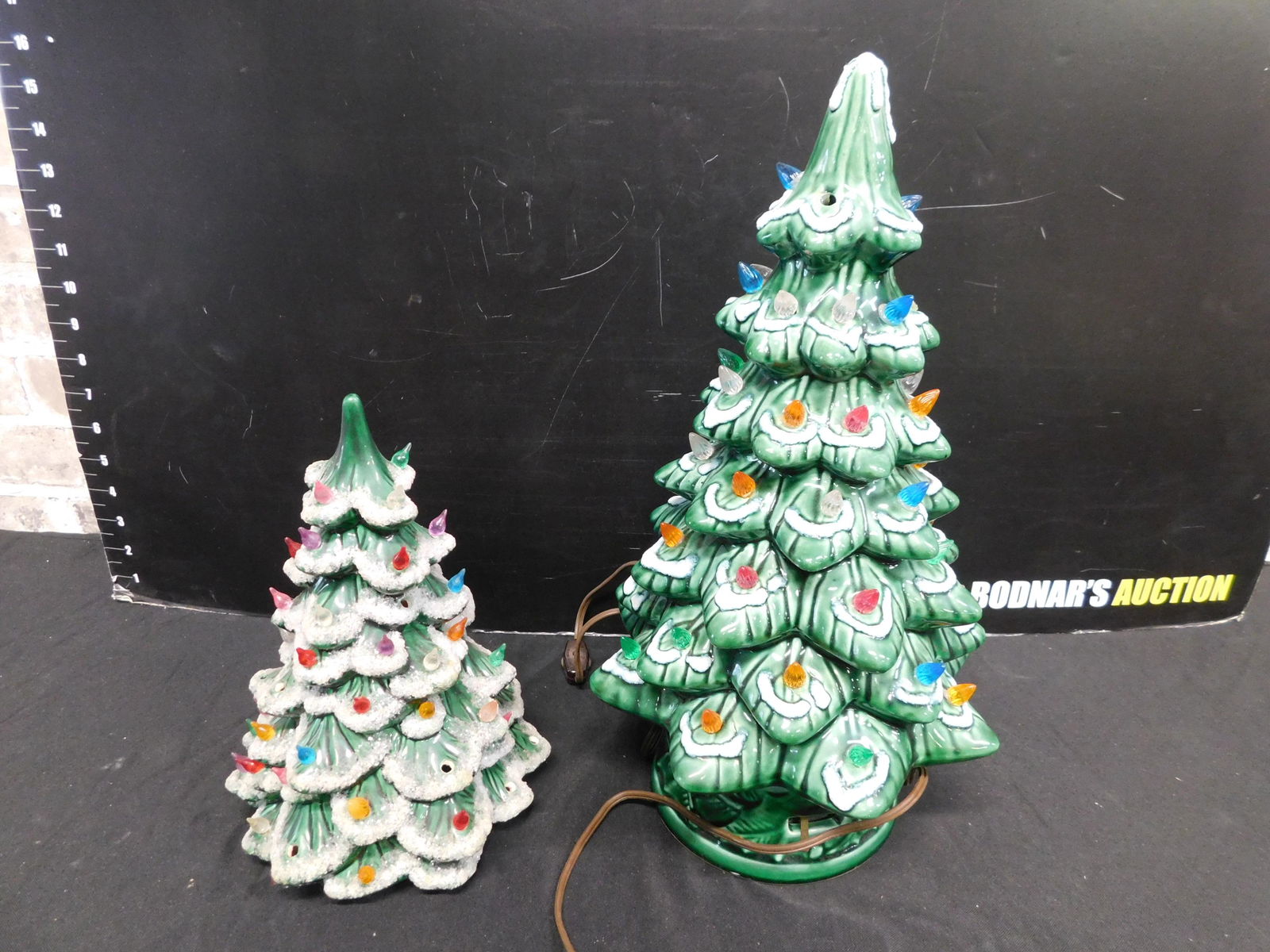 Box Lot with Lighted Christmas Trees: Box Lot with Lighted Christmas Trees. This sale will be broadcast live on sale day with an auctioneer and caller calling full descriptions of each lot being sold, as well as video feed of each lot. Al