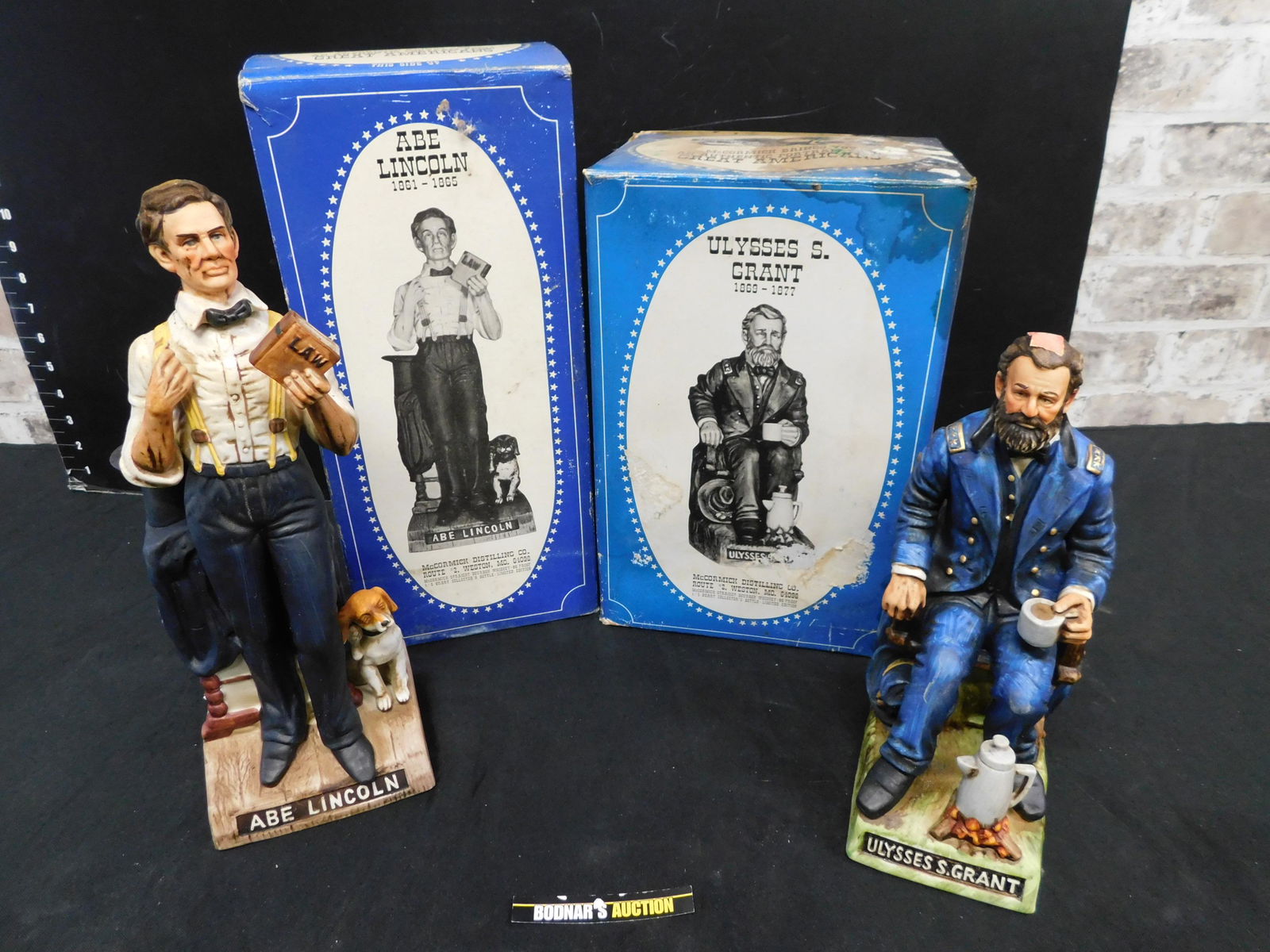 Lot of 2 "The Patriots" Decanters: Lot of 2 "The Patriots" Decanters including Abe Lincoln and Ulysses S. Grant. This sale will be broadcast live on sale day with an auctioneer and caller calling full descriptions of each lot being sol