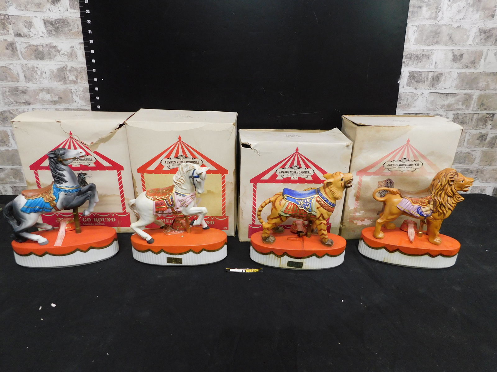 Lot of 4 Carousel Animal Series Decanters: Lot of 4 Carousel Animal Series Decanters. This sale will be broadcast live on sale day with an auctioneer and caller calling full descriptions of each lot being sold, as well as video feed of each lo
