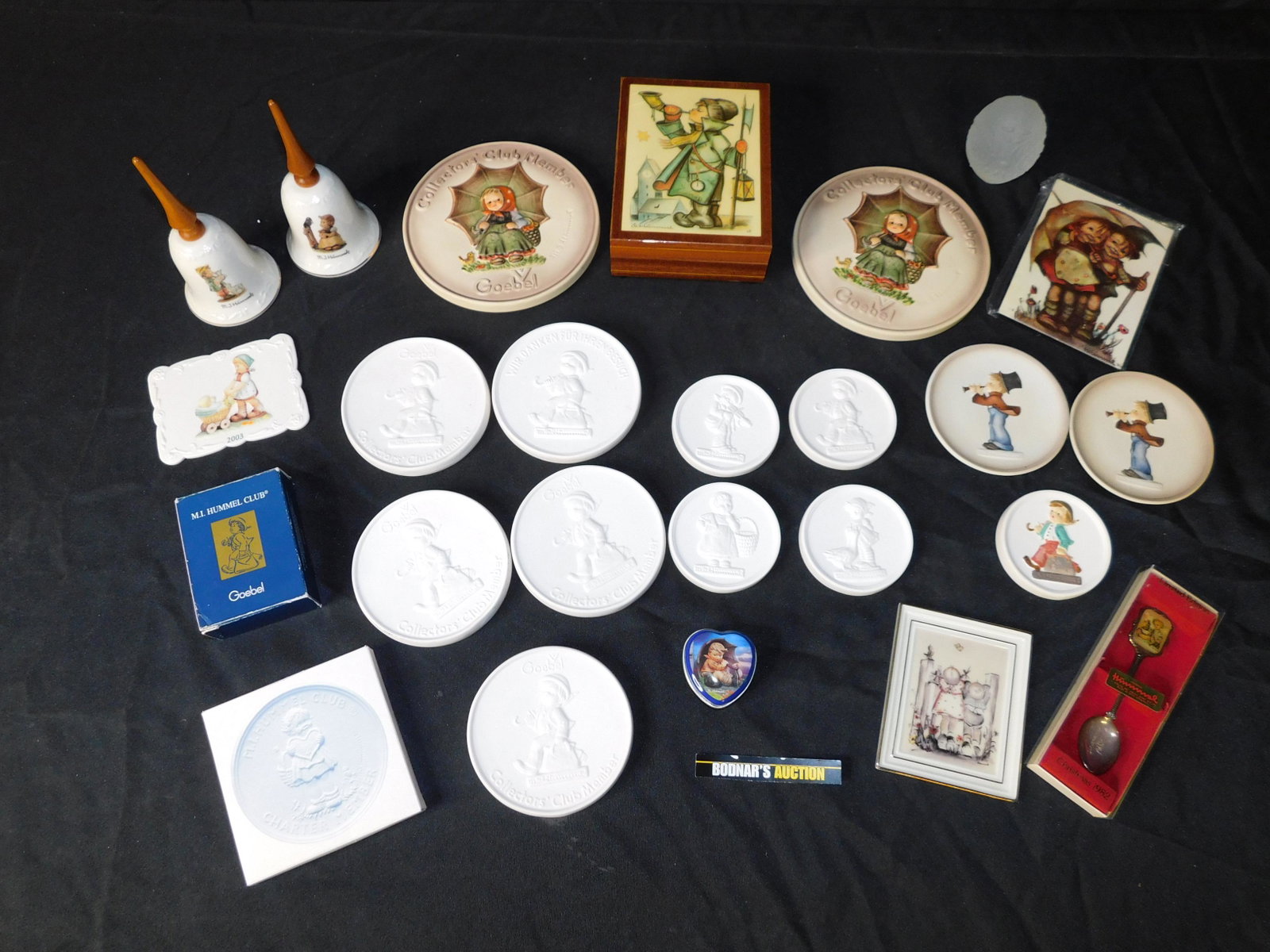 Box Lot of Hummel Related Items: Box Lot of Hummel Related Items including Mini Plates and a Musical Jewelry Box. This sale will be broadcast live on sale day with an auctioneer and caller calling full descriptions of each lot being 