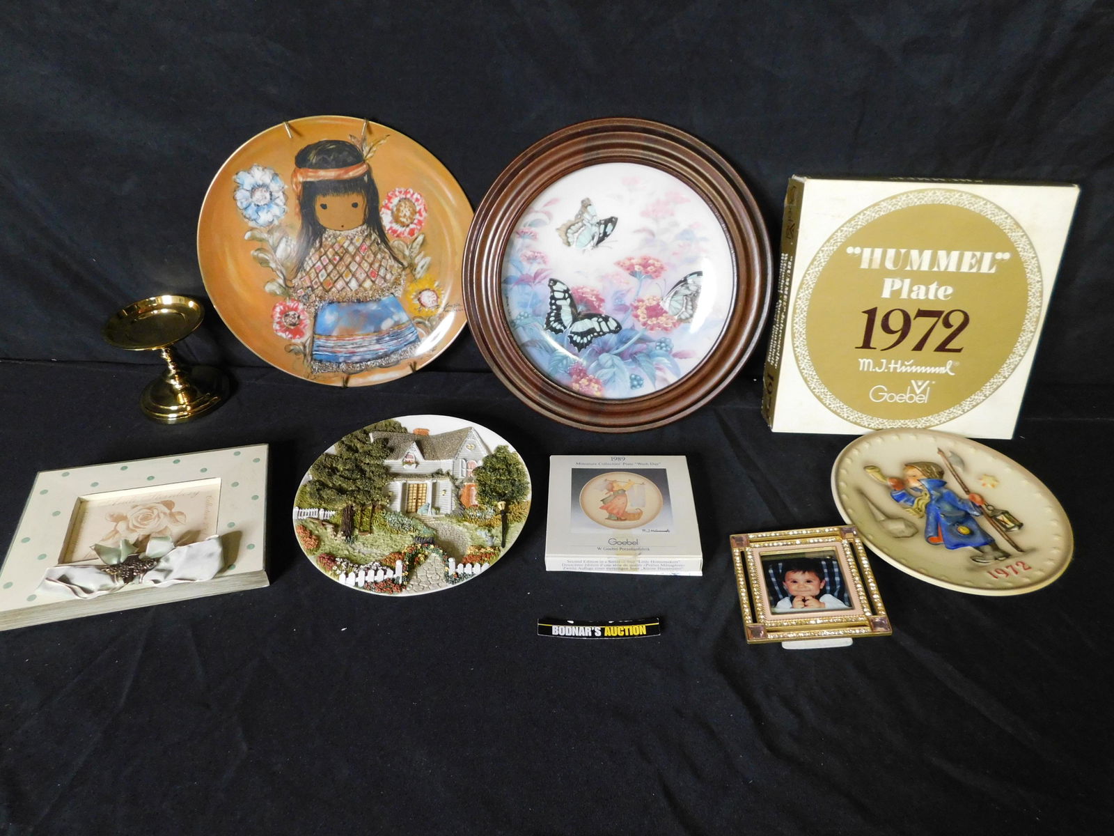 Box Lot of Collector Plates including Hummel: Box Lot of Collector Plates including Hummel. This sale will be broadcast live on sale day with an auctioneer and caller calling full descriptions of each lot being sold, as well as video feed of each