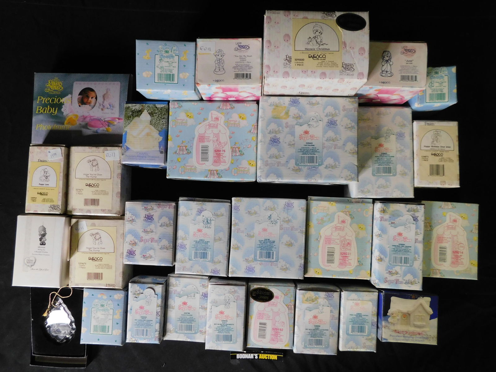 Box Lot of Precious Moments including Sugar Town: Box Lot of Precious Moments including Sugar Town. This sale will be broadcast live on sale day with an auctioneer and caller calling full descriptions of each lot being sold, as well as video feed of