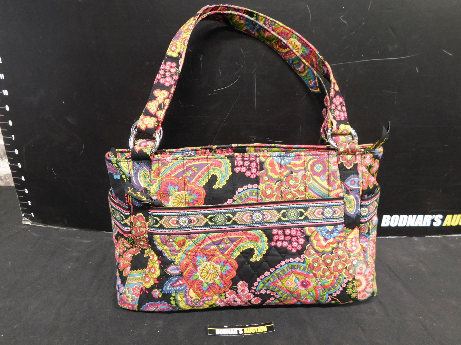 Vera Bradley Pocketbook: Vera Bradley Pocketbook. This sale will be broadcast live on sale day with an auctioneer and caller calling full descriptions of each lot being sold, as well as video feed of each lot. All items MUST