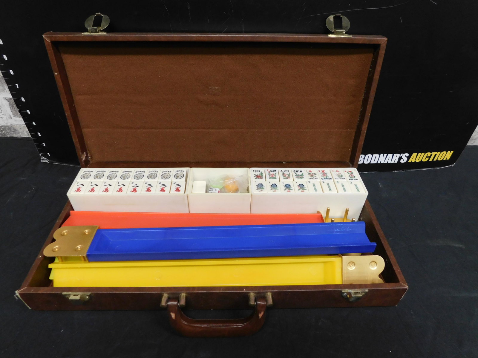 Mahjong Set in Case: Mahjong Set in Case. This sale will be broadcast live on sale day with an auctioneer and caller calling full descriptions of each lot being sold, as well as video feed of each lot. All items MUST be p