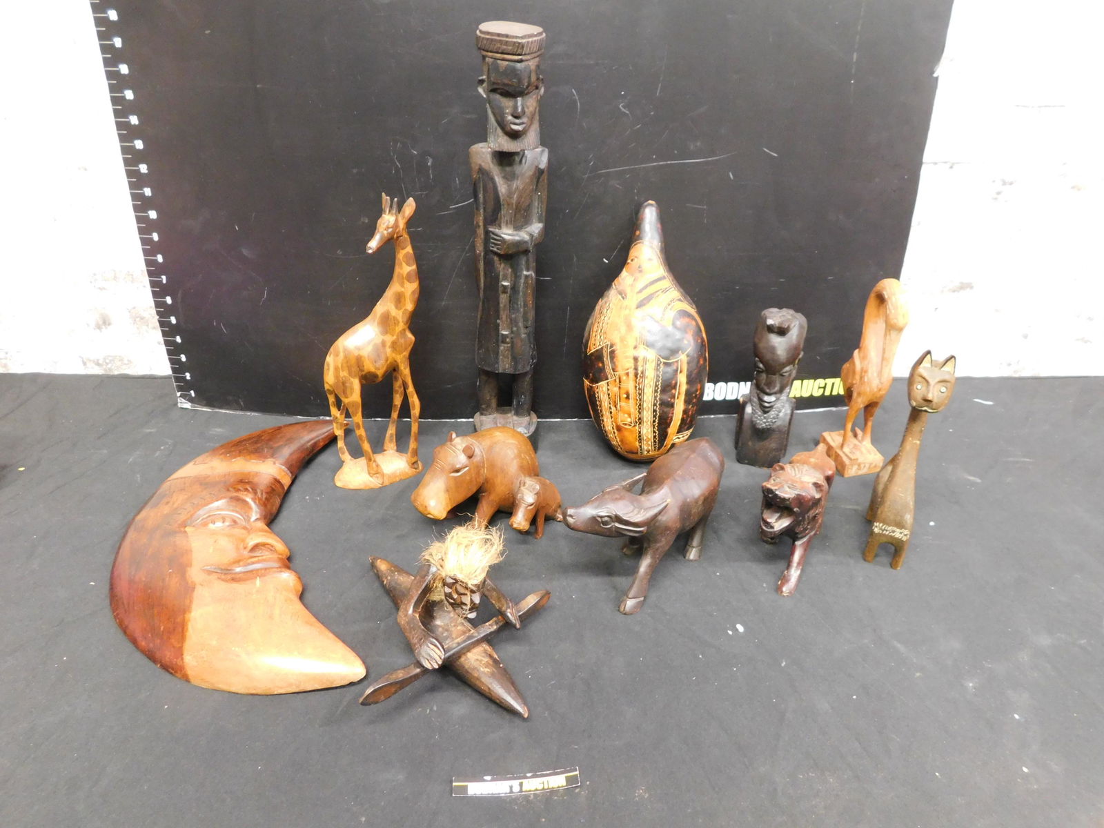 Large Lot of Wooden African Decorations and Figures: Large Lot of Wooden African Animals and Figures. This sale will be broadcast live on sale day with an auctioneer and caller calling full descriptions of each lot being sold, as well as video feed of e