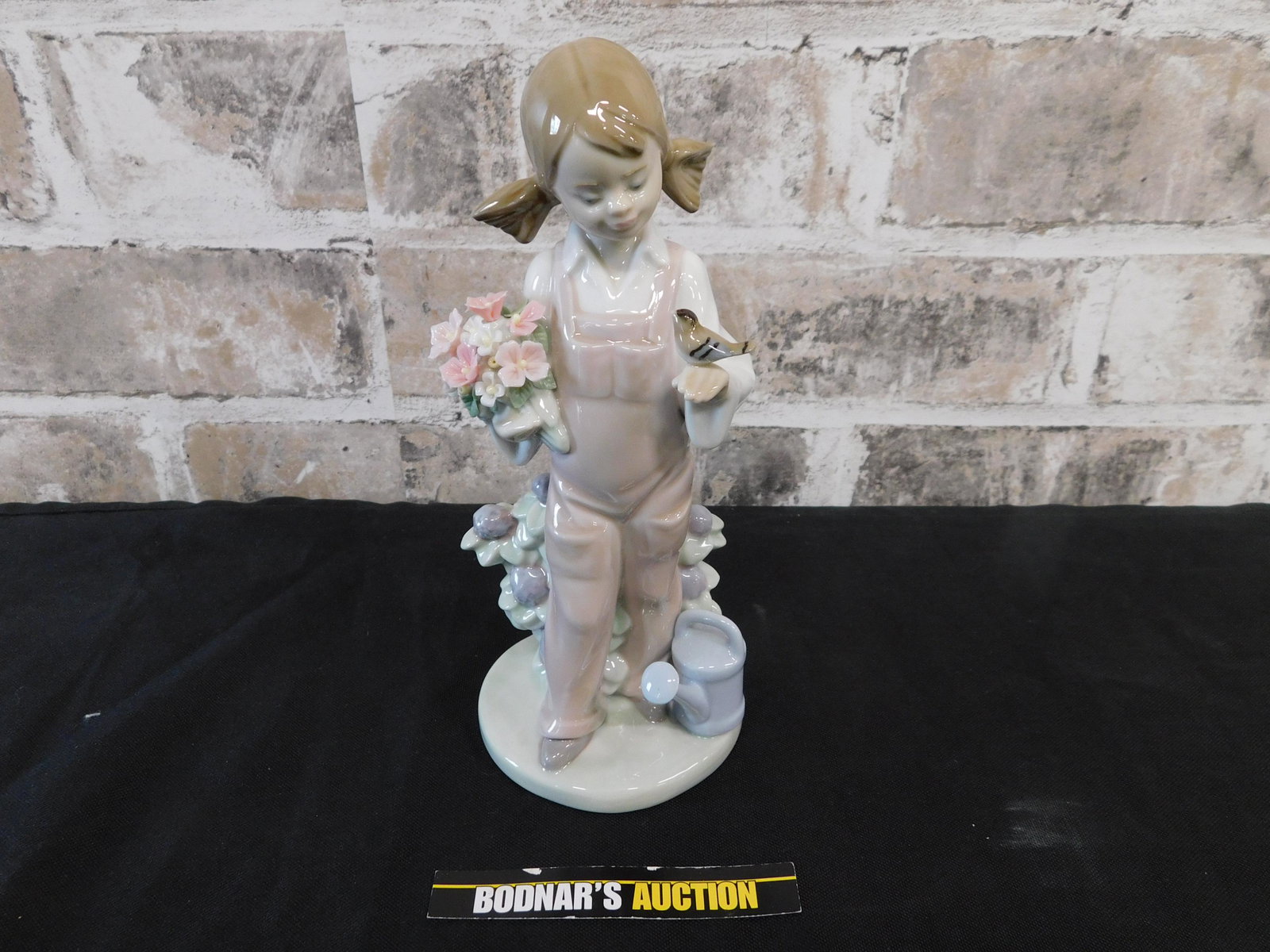 Lladro Little Girl with Bird: Lladro Little Girl with Bird. 5217. Possible Chip on one of the flower leaves. Measures 7.5" tall. We are offering contact-less pick ups at our South Brunswick location by APPOINTMENT ONLY on the Frid