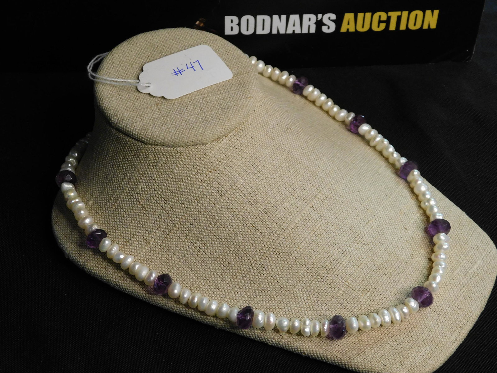 Pearl & Amethyst Necklace: Pearl & amethyst beaded necklace with sterling clasp (gold vermeil finish). Marked on clasp "Sterling". Measures approx. 20". You are bidding at a live sale, please read the terms and conditions. We a