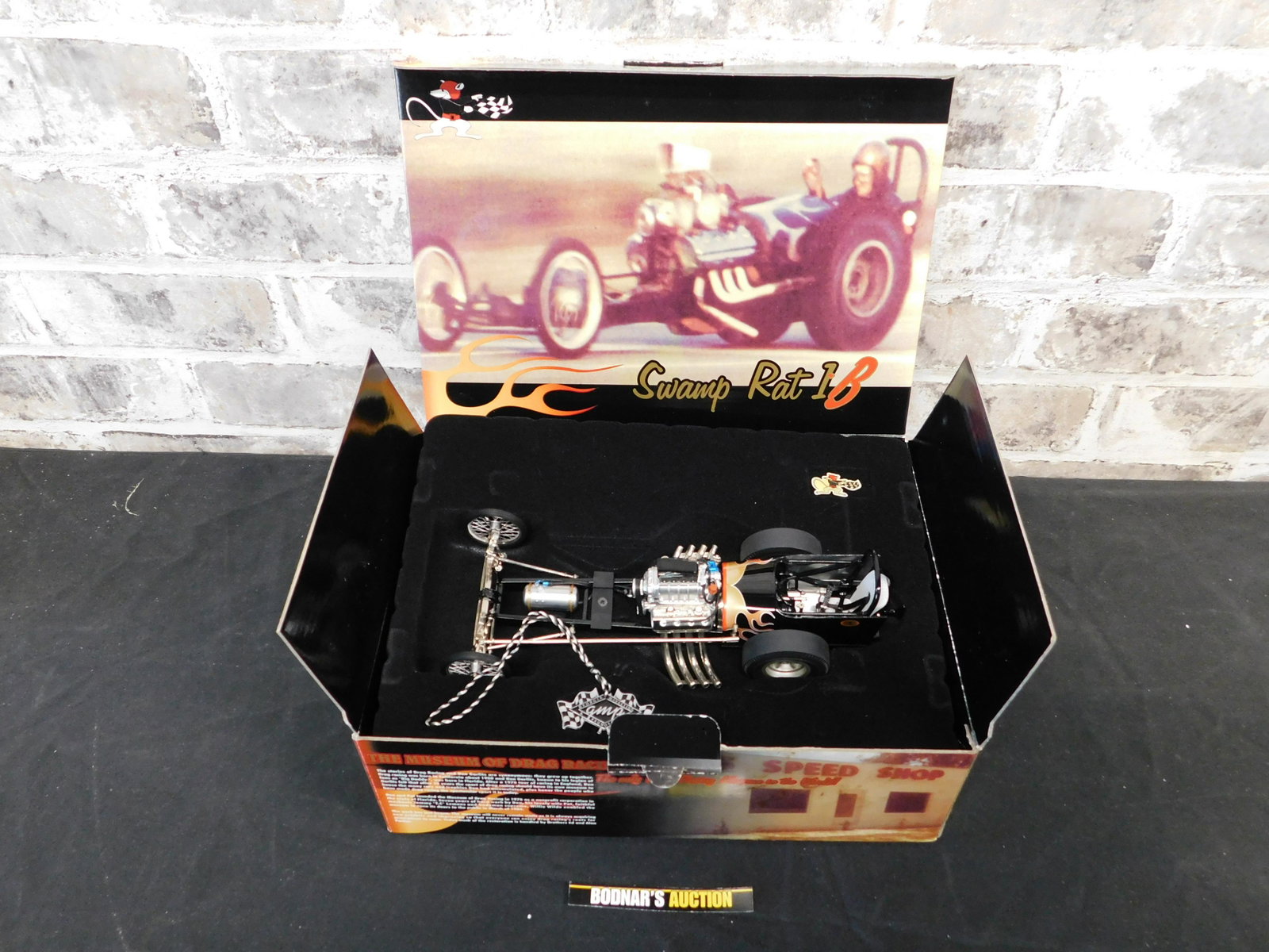 GMP "Big Daddy" Don Garlits Swamp Rat 1B: GMP "Big Daddy" Don Garlits Swamp Rat 1B 1:18 Scale Die-Cast. Limited Edition to 5904 Pieces. You are bidding at a live sale, please read the terms and conditions. We are offering contact-less pick up