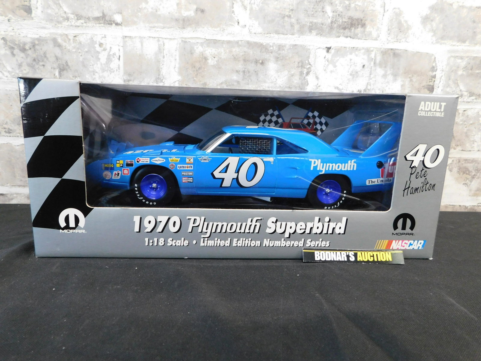 Mopar 1970 Plymouth Superbird - Pete Hamilton - Winged: Mopar 1970 Plymouth Superbird - Pete Hamilton - Winged Warriors #6 in Series - 1:18 Scale Die-Cast Car. You are bidding at a live sale, please read the terms and conditions. We are offering contact-le