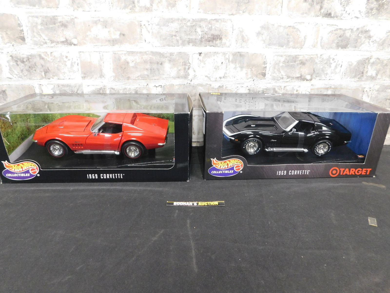 Lot of 2 Hot Wheels 1969 Corvette 1:18 Scale Die-Cast: Lot of 2 Hot Wheels 1969 Corvette 1:18 Scale Die-Cast Cars. One is Red and the other is Black. You are bidding at a live sale, please read the terms and conditions. We are offering contact-less pick u