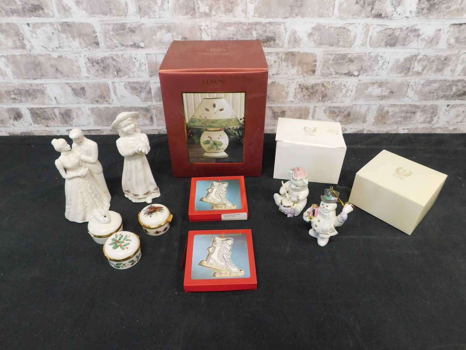 Box Lot of Lenox: Box Lot of Lenox including Lamp in Box, Ornaments, Figurines, and Covered Pill Boxes. This sale will be broadcast live on sale day with an auctioneer and caller calling full descriptions of each lot b