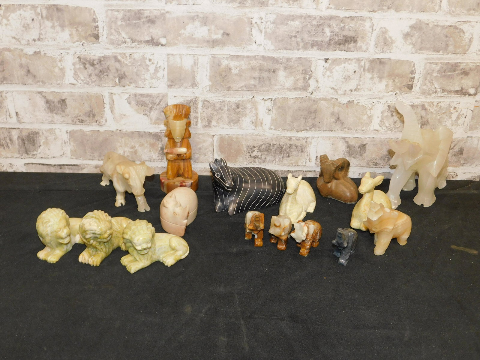 Large Lot of Carved Stone and Alabaster Figurine Lot: Large Lot of Carved Stone and Alabaster Figurine Lot. Some As-Is. This sale will be broadcast live on sale day with an auctioneer and caller calling full descriptions of each lot being sold, as well a