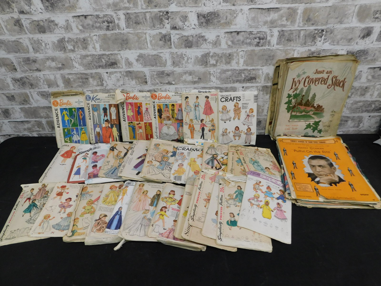 Lot of Patterns and Sheet Music: Lot of Patterns and Sheet Music. Many of the Patterns are for Barbie and Other Dolls. Some are Used and may not be complete. The Sheet Music contains lots of showtunes. This sale will be broadcast liv
