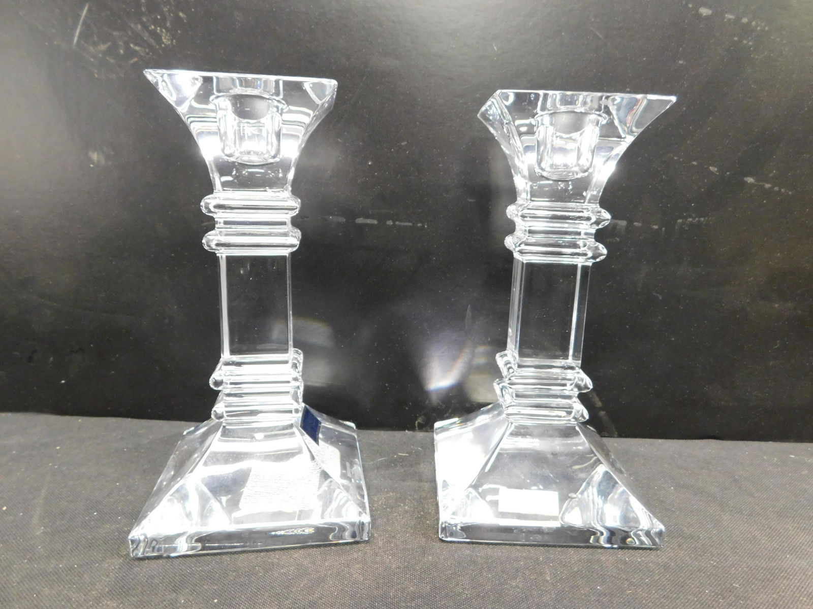 Pair of Marquis by Waterford Candlesticks: Pair of Marquis by Waterford Candlesticks. Measures 6" tall. This sale will be broadcast live on sale day with an auctioneer and caller calling full descriptions of each lot being sold, as well as vid