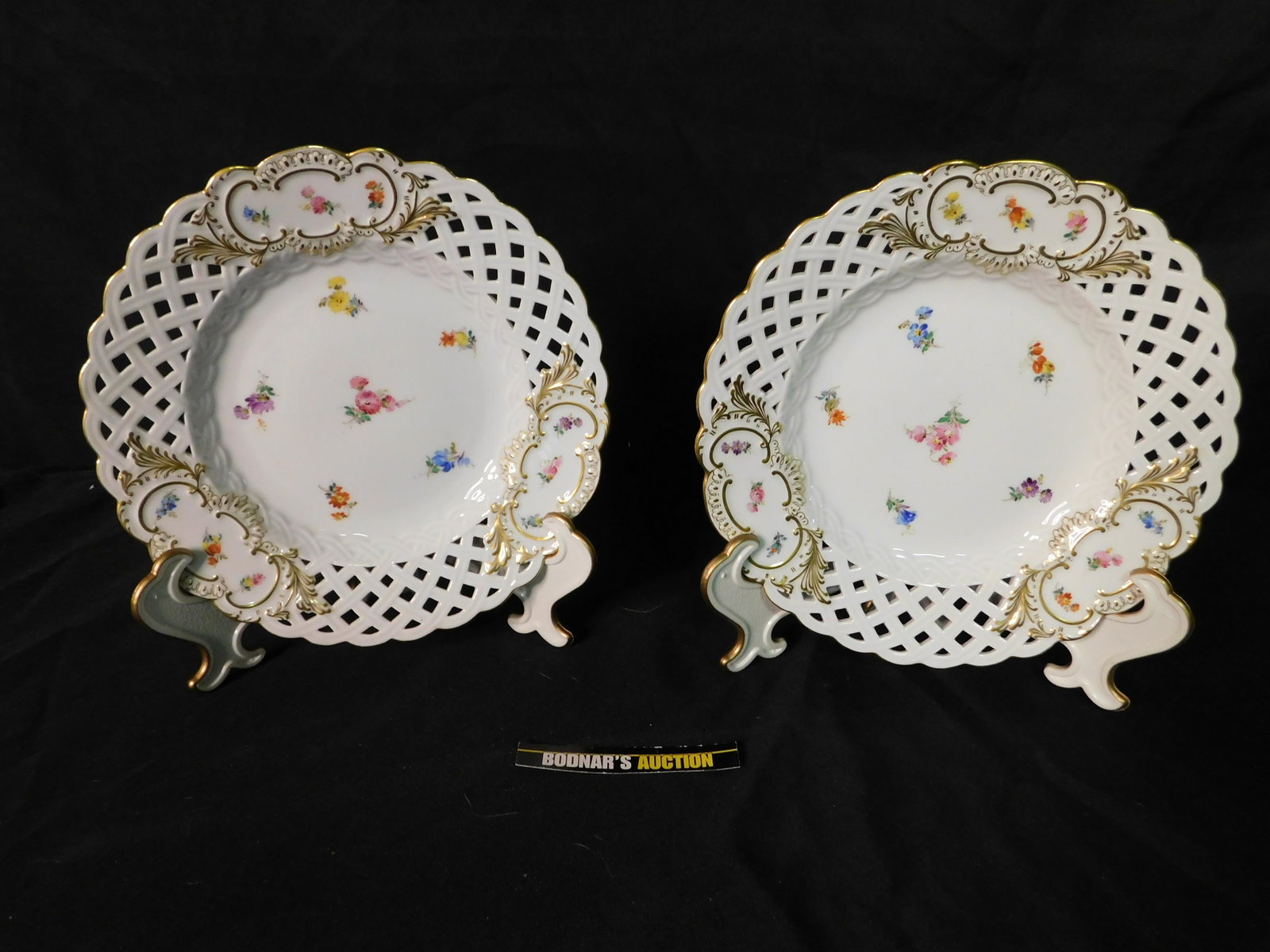 Lot of 2 Meissen Bone China Pierced Edge Dessert Plates: Lot of 2 Meissen Bone China Pierced Edge Dessert Plates. They measure 8.5" diameter. You are bidding at a live sale, please read the terms and conditions. We are offering contact-less pick ups at our 