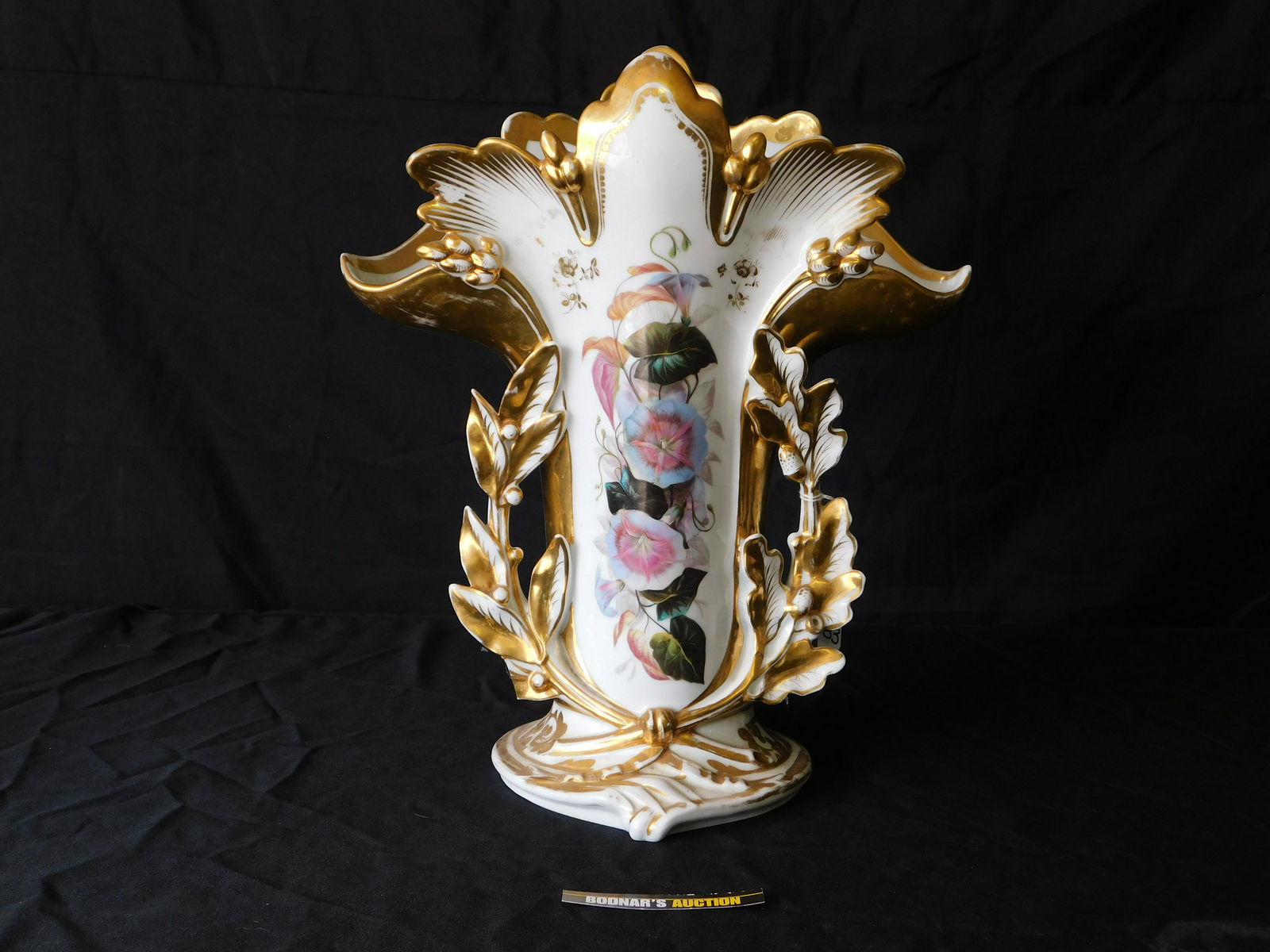 Old Paris Porcelain Tall Vase: Old Paris Hand-Painted with Gold Matte Porcelain Tall Vase. Some Loss to Gold Paint. Measures 15" tall x 13" wide. You are bidding at a live sale, please read the terms and conditions. We are offering