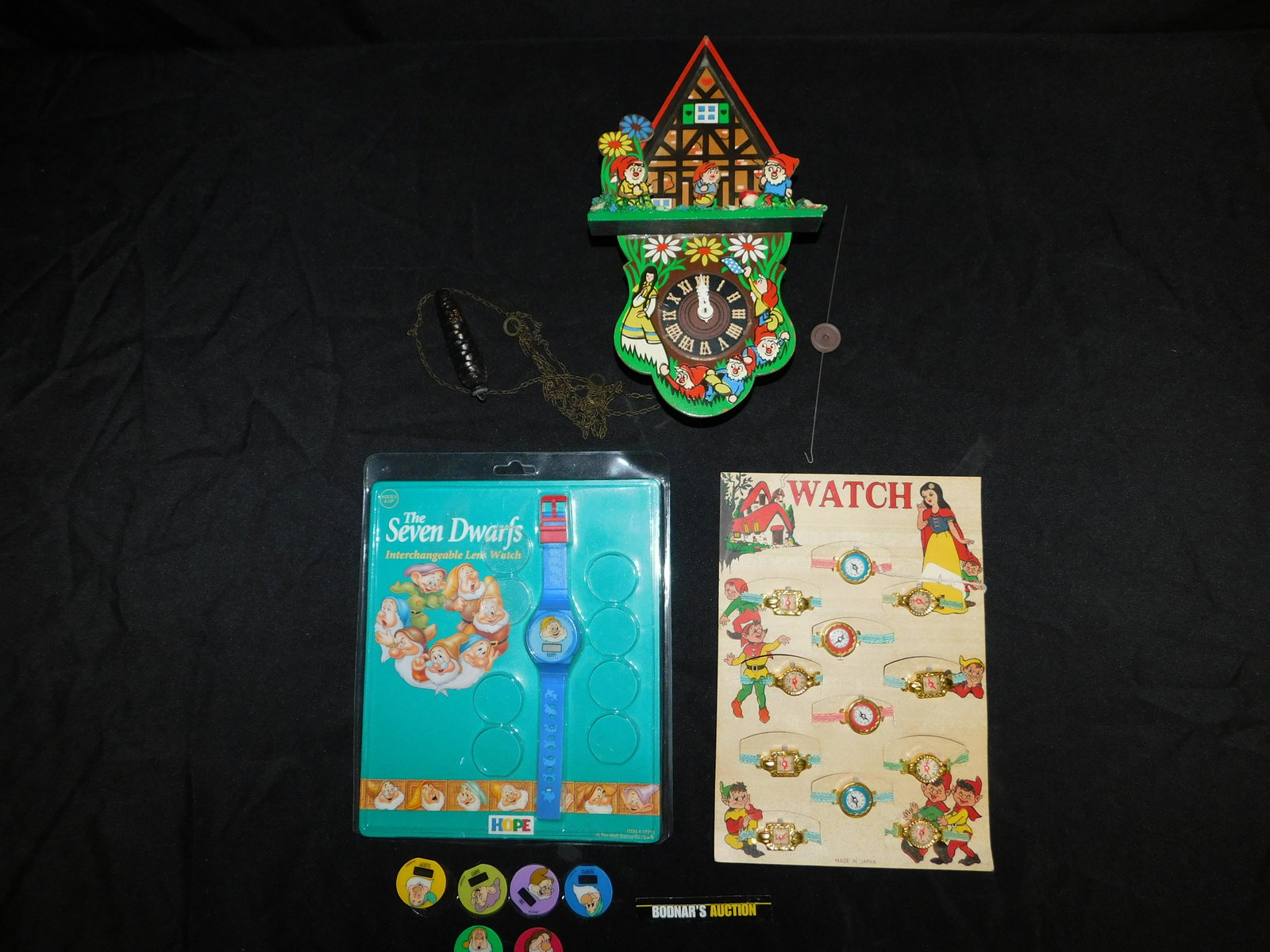 Grouping of Snow White Items including German Cuckoo: Grouping of Snow White items including German Wooden Clock - Face is a little AS-IS - Helmut Kammerer Watchmaker, Seven Dwarfs Watch with Interchangeable Lens, and Vintage Snow White Store Display wit